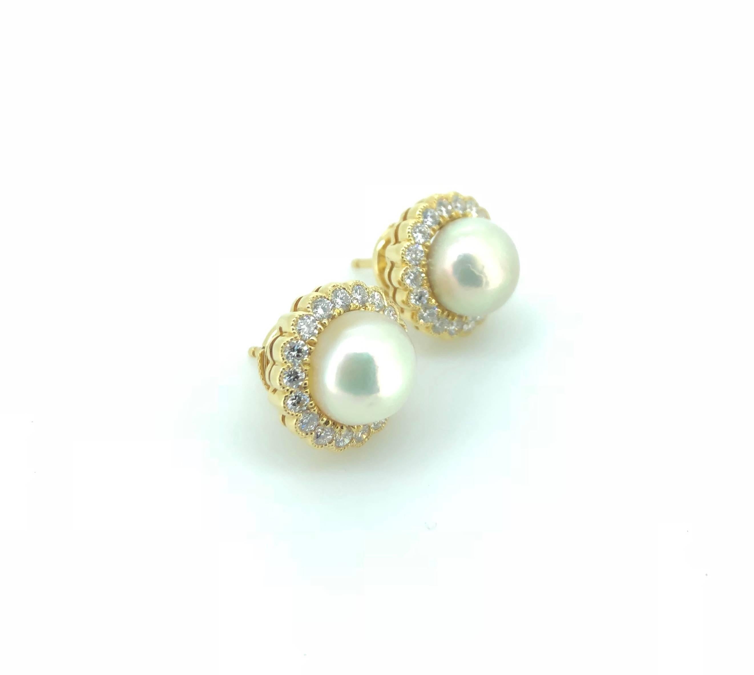 A Pair of classic and timeless Natural Saltwater Pearl Button Diamond Earrings. 
Mounted in 18K Yellow Gold and surrounded by cluster of round brilliant cut diamonds in milgrain pave setting.  The pair of Pearl buttons measure between 8.3 - 9.0mm