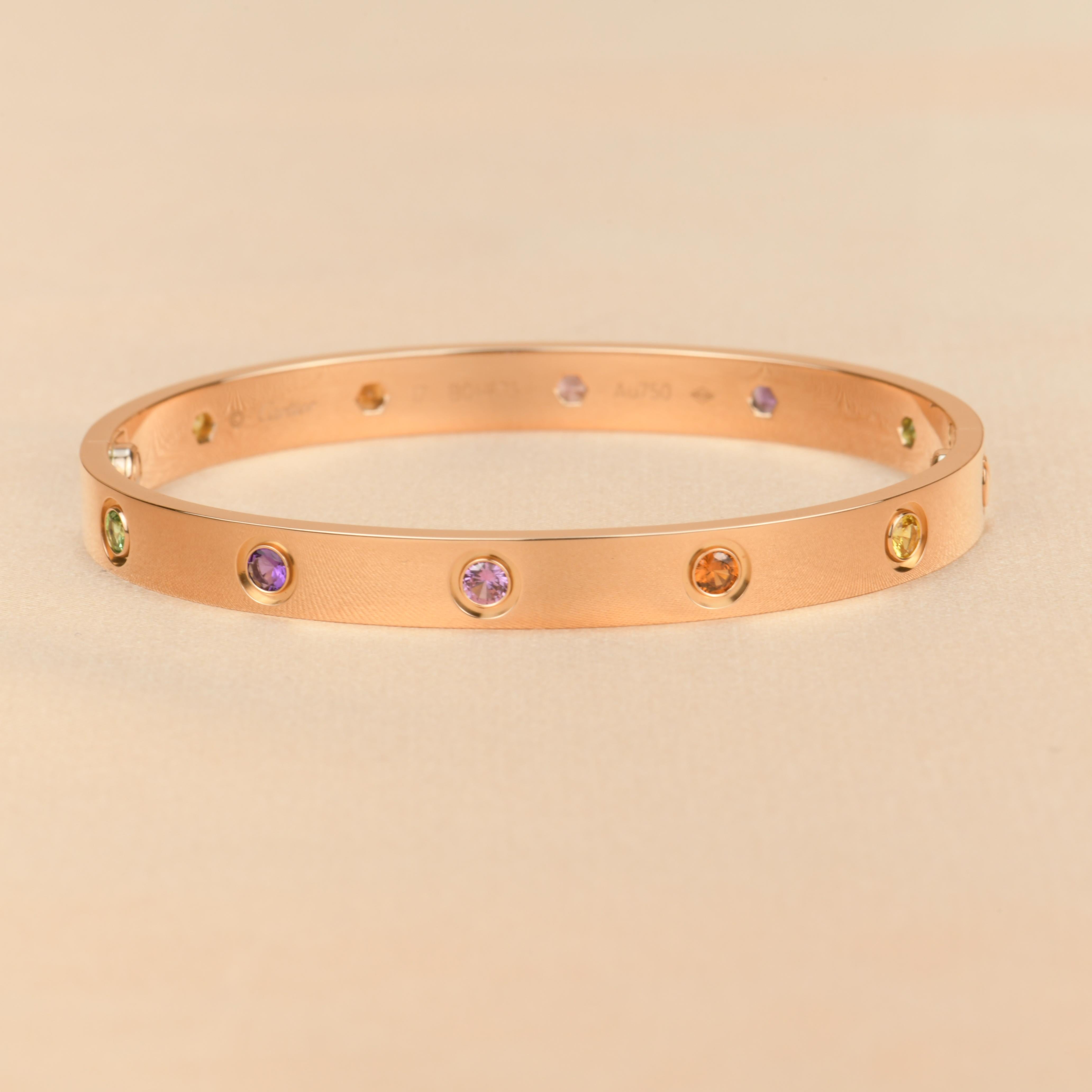 Dandelion Antiques Code AT-1067
Brand Cartier
Model B6036516
Date: 2022
Serial No: BOU***
__________________________________
Metal 18K Rose Gold
Stone:
2 pink sapphires
2 yellow sapphires 
2 green garnets
2 orange garnets
2