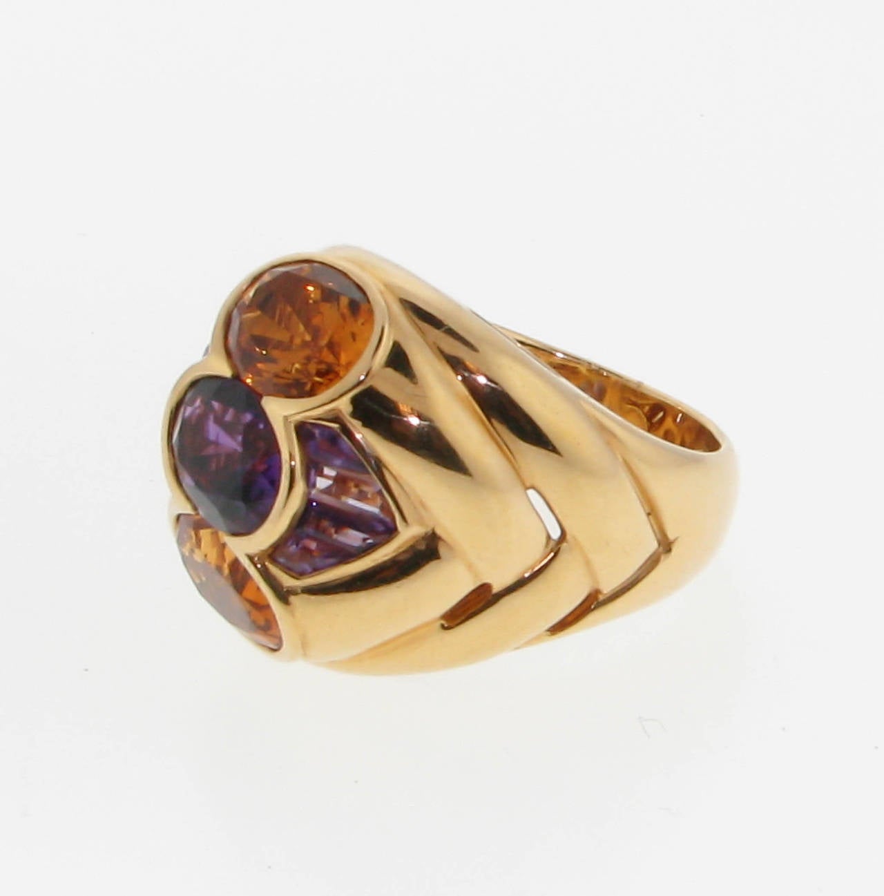 18kt gold and colored stone ring.