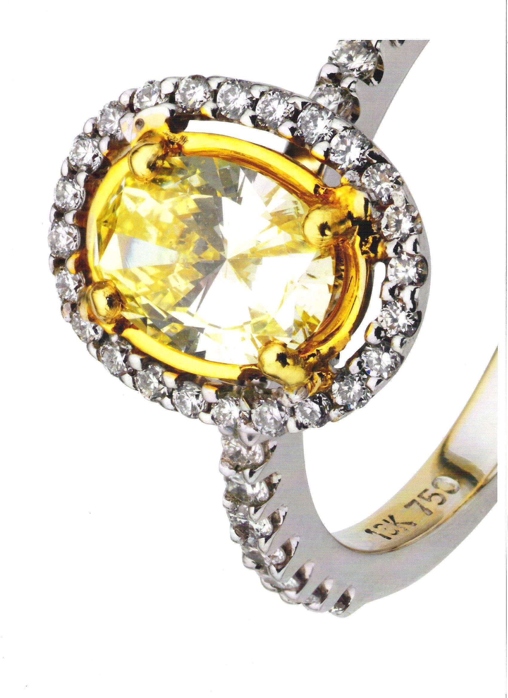 Art Nouveau Yellow Oval Diamond 18 Carat White Gold Halo Engagement Ring For Sale