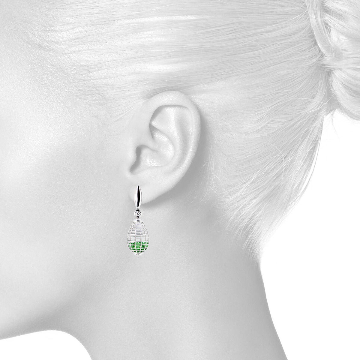 From the Wired Collection, teardrop earrings in 18k white gold with 5 cts of loose tsavorites, reverse-set white sapphire bottom caps (0.32 ct), and bezel-set white diamond ear tops (0.12 ct). Satin finish with polished highlights. Rectangular grid