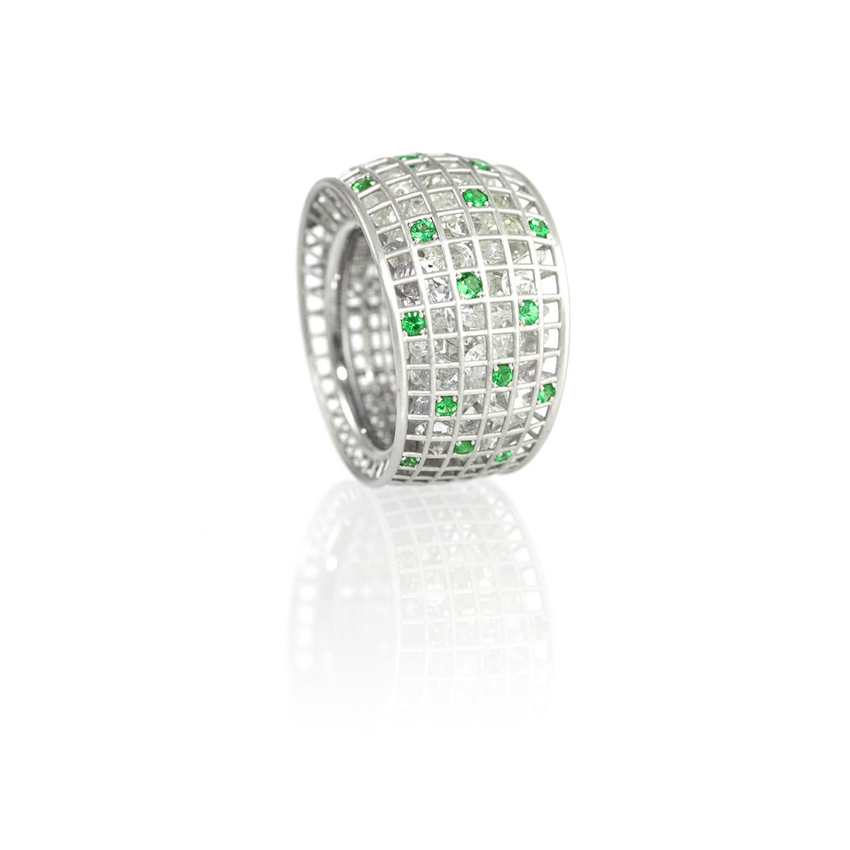 From the Wired Collection, an 18k white gold ring with an Art Deco feel, set with tsavorite garnets (0.64 ct) and filled with loose white sapphires (17 cts). Square grid pattern. Size 6-3/4.