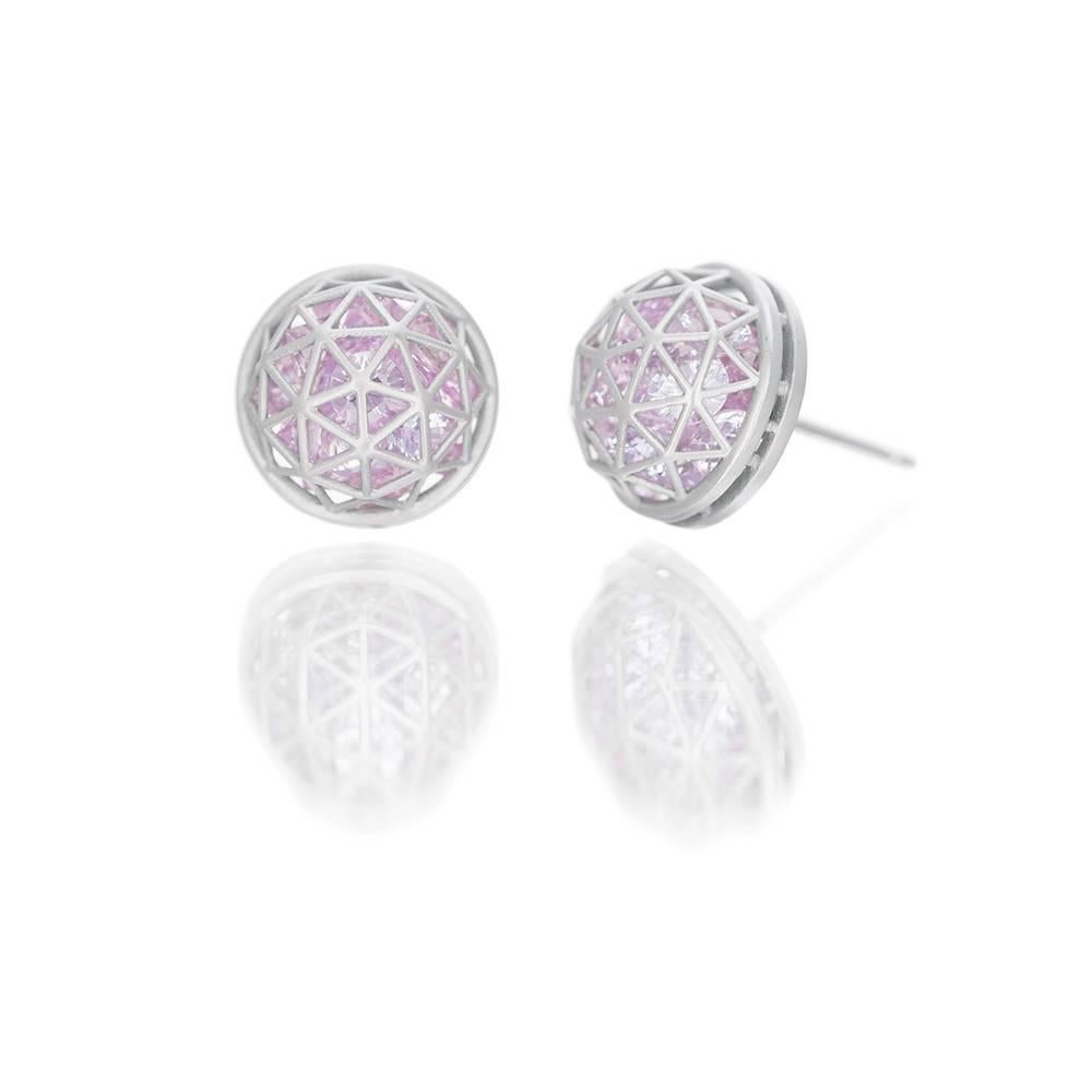 From the Wired Collection, a pair of 18k white gold stud earrings filled with loose pastel pink sapphires (9 cts). Geodesic pattern, satin finish with polished back. Diameter 12mm or approx 1/2