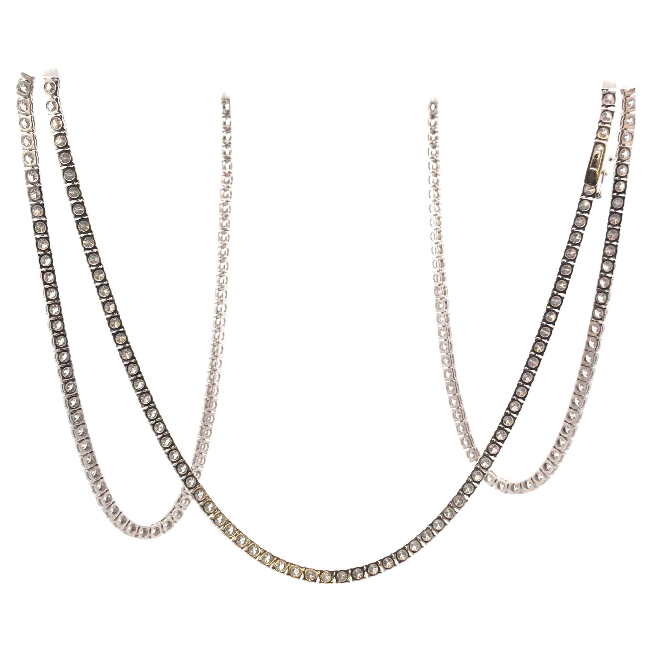 18 Karat White Gold Diamond Tennis Necklace weighing 84.4 grams, 47.25 inches in length. The necklace is further enhanced with a total of 300 round brilliant cut diamonds weighing approximately 58.40 carats, well matched, Color Range of: H-I,