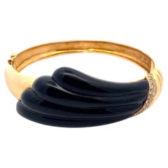 Armreif aus 18-karätigem Gelbgold mit schwarzem Onyx und einem Diamanten von 0,50 Karat