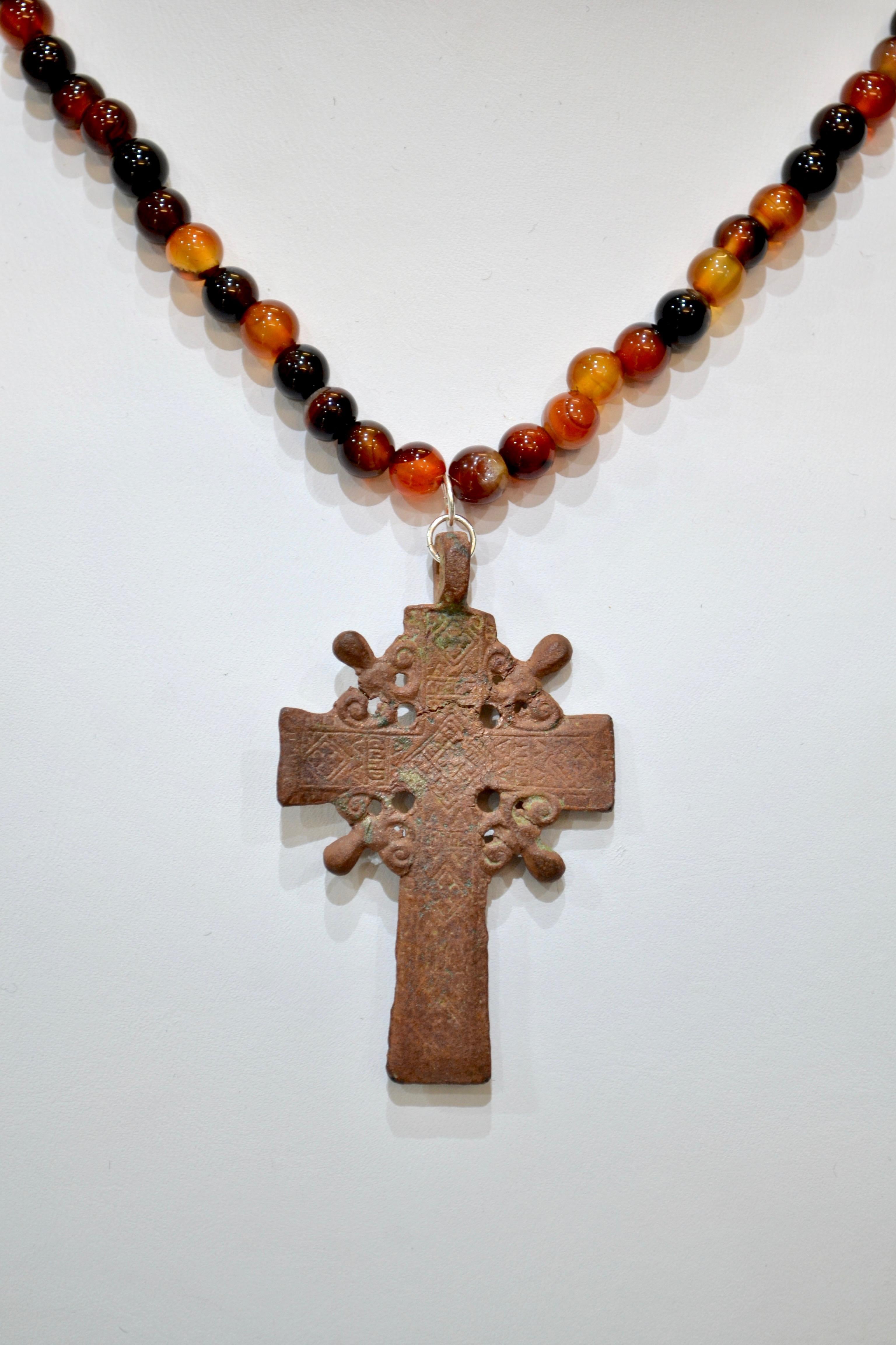 Late Medieval Bronze Radiate Cross Pendant. Professionally cleaned and polished to show original details. Obtained from an old British collection, acquired from the L.C.F. (London) Mounted on a beaded agate necklace 