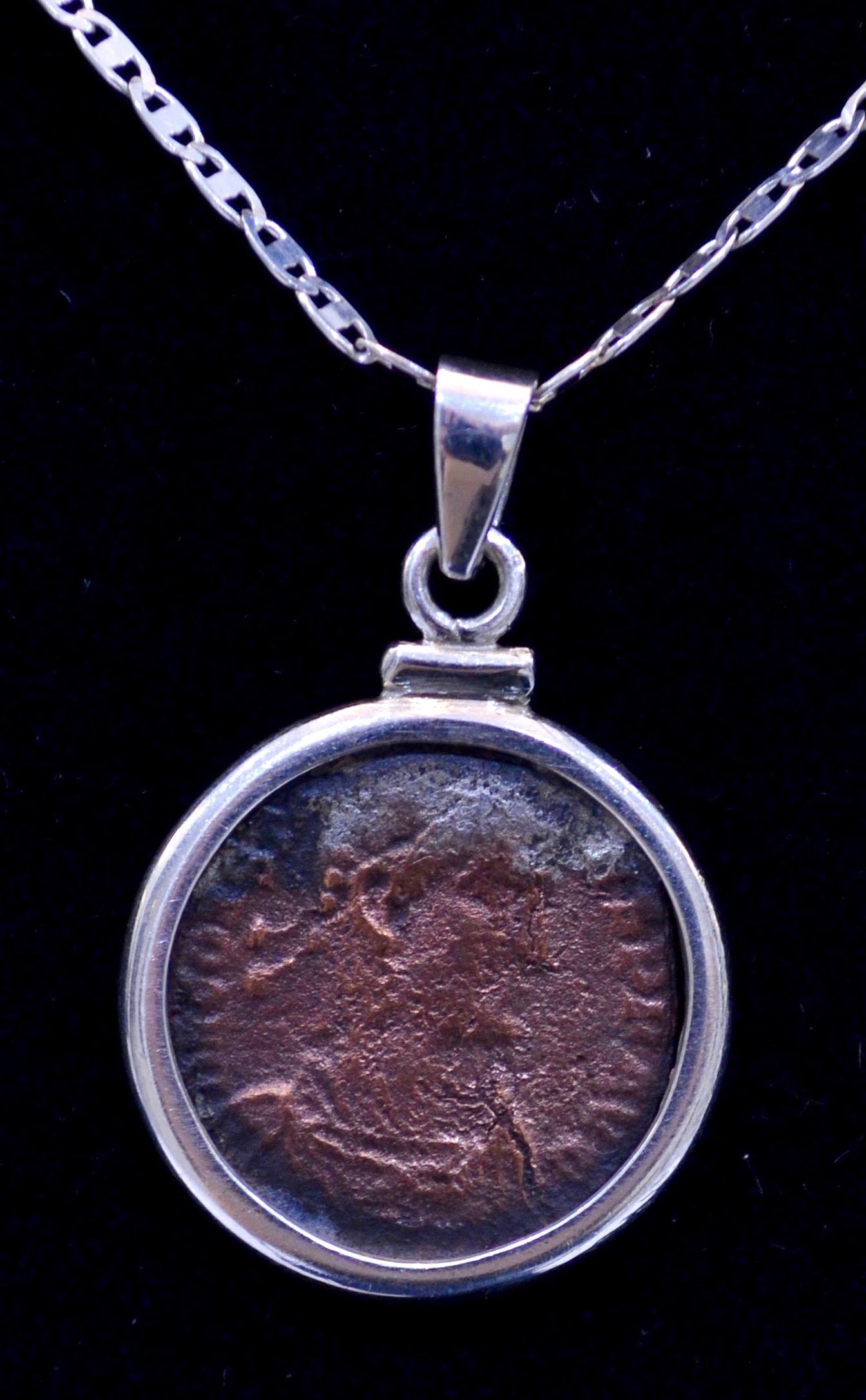 Authentic  roman bronze coin Ca. 337-350 CE mounted on contemporary silver necklace. Ready to be worn!

Flavius Julius Constans, the youngest son of Constantine the Great, he adopted the title of Augustus (along with his 2 brothers - Constantius II