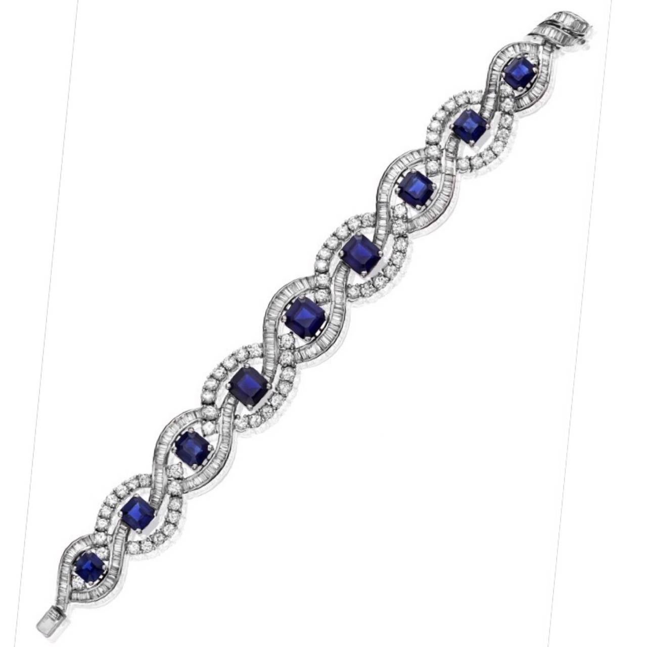 Approximately 21.00ct t.w. Unheated Emerald Cut Deep Blue Sapphires
Approximately 24.00ct t.w. Round And Tapered Baguette Diamonds 
Hand made and set in Platinum! This bracelet is a work of art. Young jewelers of this century mostly do not have