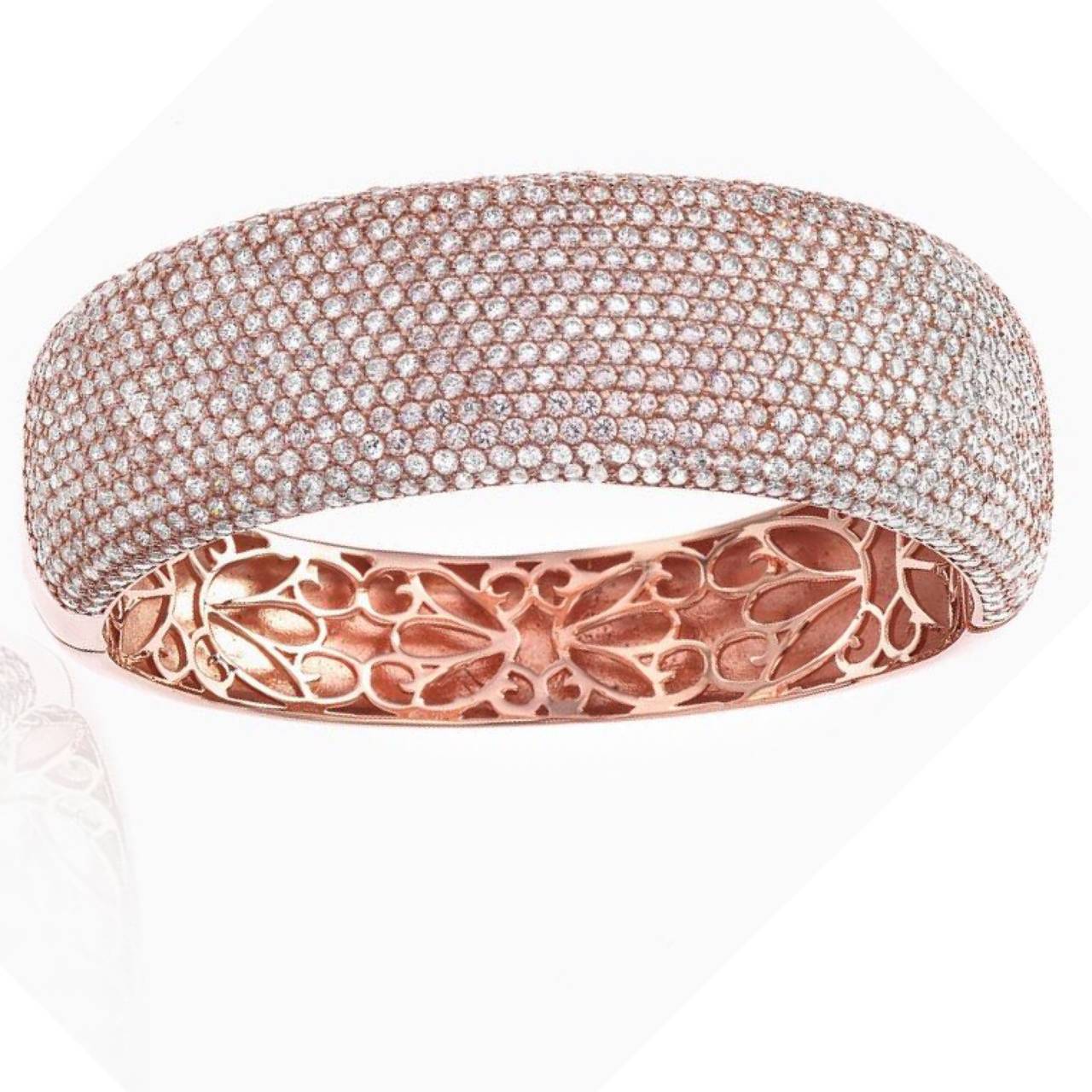 Hand made by our skilled craftsmen in 18K Rose gold! We carefully selected 772 white round perfectly cut natural diamonds to create this masterpiece diamond bangle. This bangle features an astonishing 15 rows of micro pave diamonds. Micro pave is a