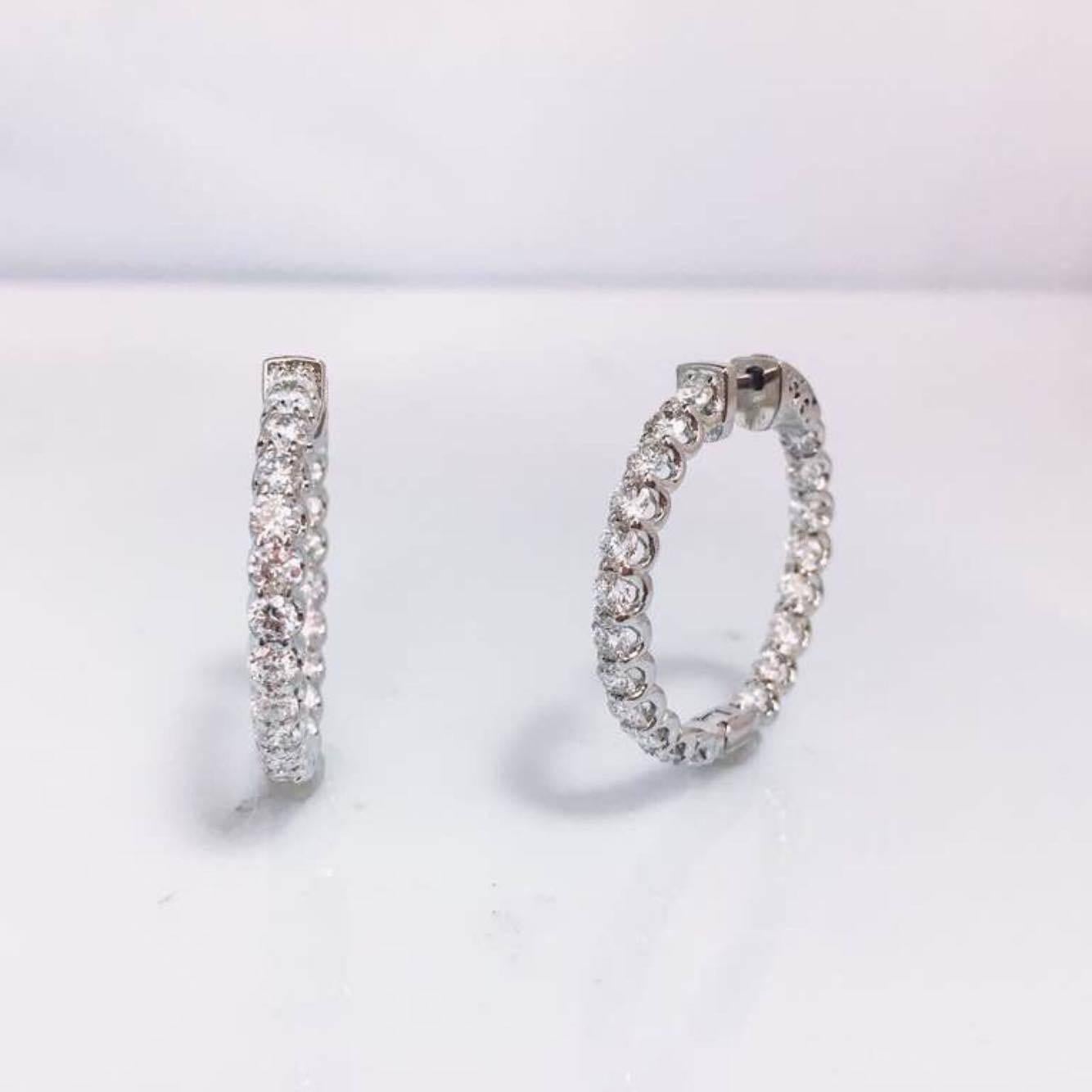 Manufactured by Emilio! here in our World Diamond Tower Headquarters on New York's world famous Fifth avenue. These hoops are unique! We set conflict free excellent cut diamonds 
F color
VVS clarity 
Appox. 4.40 carats total weight 
Push locking