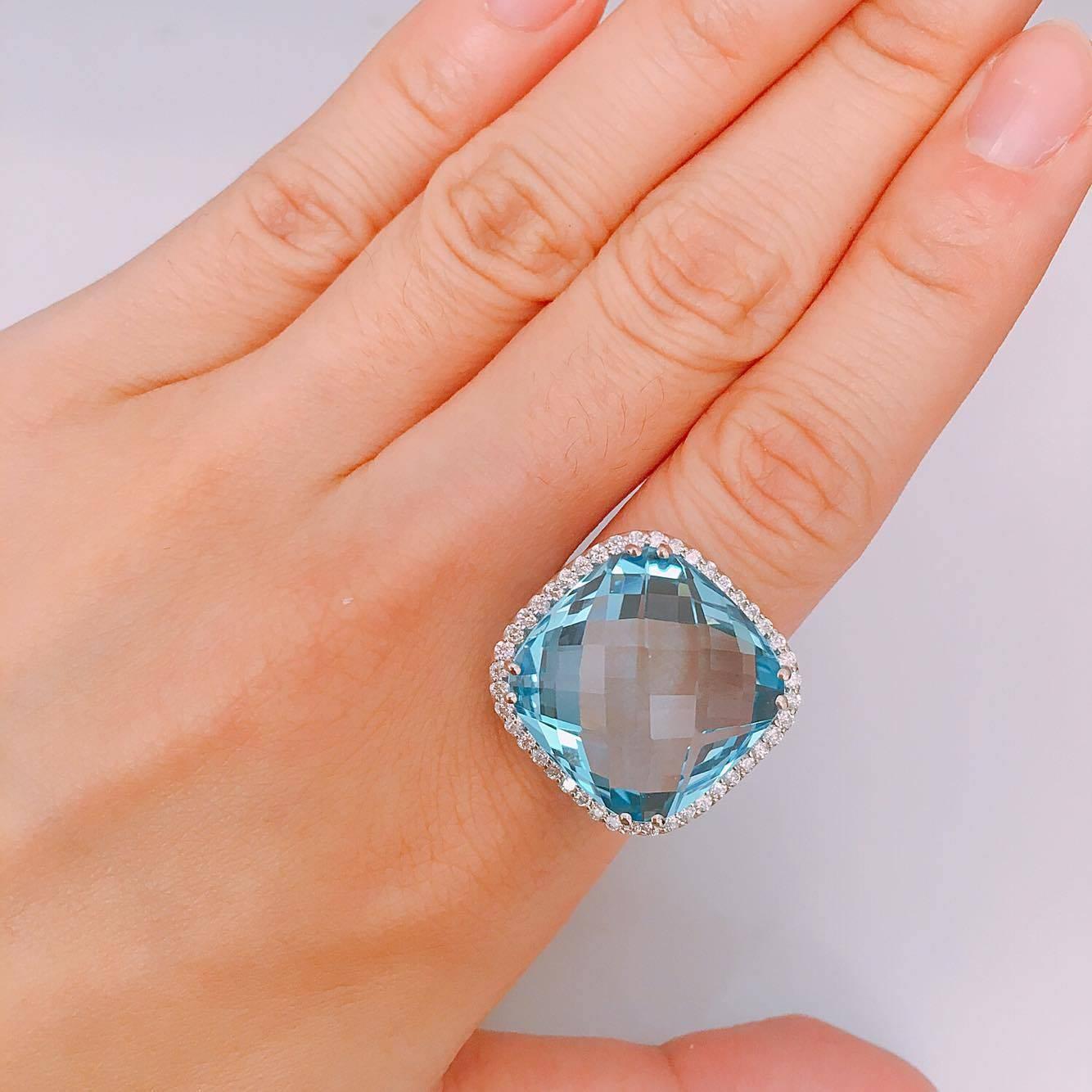 28.00ct Blue Topaz Center
1.00ct t.w. Diamond VVs Clarity F color conflict free diamonds. If you prefer this piece in all white/yellow/rose gold and blackened gold, you can order it that way as well. 
All finger sizes available at no additional