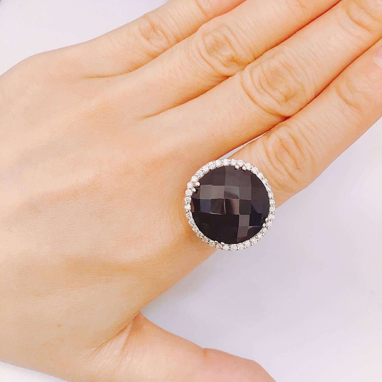 21.00ct Smokey Quartz Center
1.00ct t.w. Diamond VVs Clarity F color conflict free diamonds. If you prefer this piece in all white/yellow/rose gold and blackened gold, you can order it that way as well. 
All finger sizes available at no additional