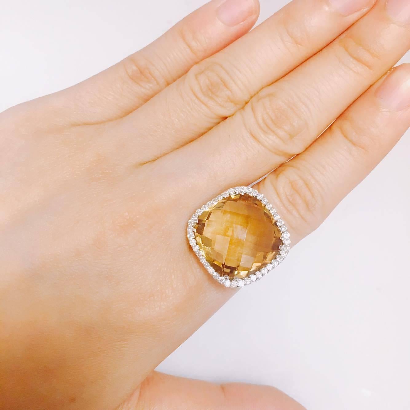 18 carat honey citrine center 
1.00ct t.w. Diamond Vs Clarity F color conflict free diamonds. If you prefer this piece in all white/yellow/rose gold and blackened gold, you can order it that way as well. 
All finger sizes available at no additional