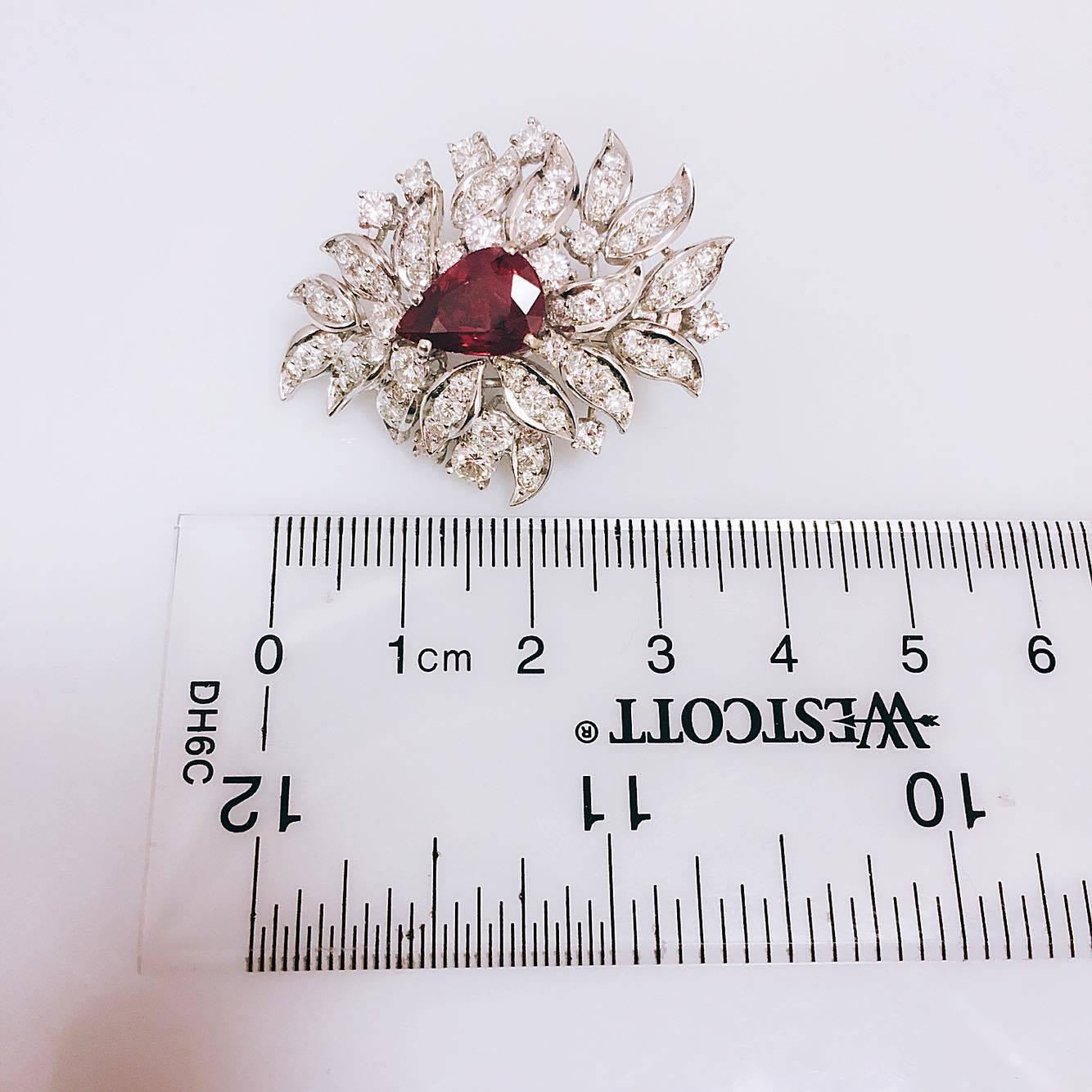 2 Pear shape Rubies weighing 6.12cts t.w. 
7.30cts t.w. Diamonds F Color VVS1 Clarity 

These amazing earrings are hand made and do not have a post. They are Clip on for ears without a piercing. However we can easily add a post and clip for pierced