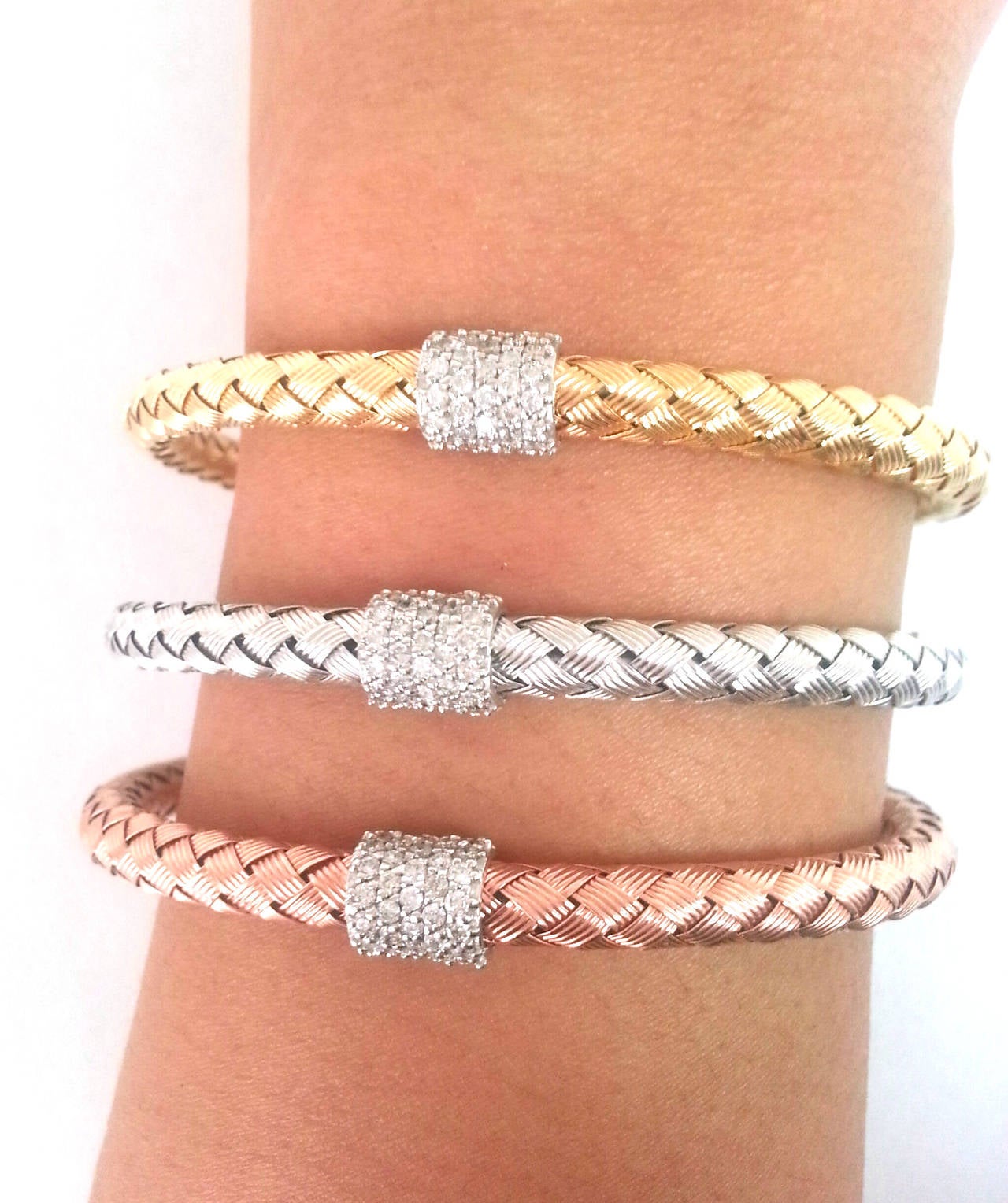 A set of three diamond bangles to be stacked the way you like! These bangles have been made with lots of generous gold which gives them a nice heavy weight and rich feel.
  
A 14k white gold, yellow gold, and rose gold mesh woven style bangles