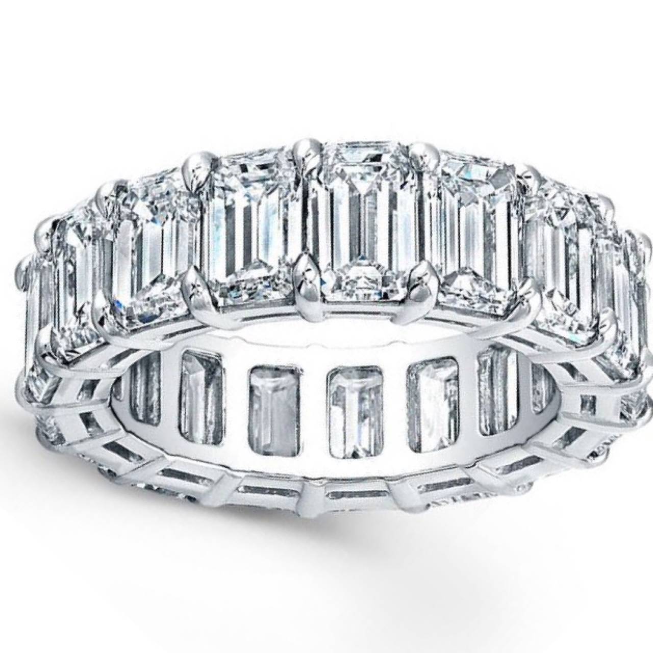 Set in our hand made platinum mounting you will feel the richness to this ring the moment you put it on your finger! Based on a standard size 7 ( available in sizes 4-13) this ring features excellent cut emerald cut diamonds all the way around. The