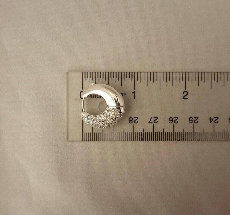 Micro pave diamond huggie earrings with push locking mechanism at