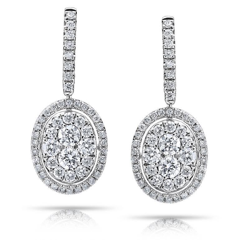 
Our Oval cluster illusion Diamond Earrings give the look of one large oval diamond! 
Color: F 
Clarity: Vs 
Cut: Excellent 

If you would like to see a video of this lovely piece please send us a message and we will be glad to arrange it!

All