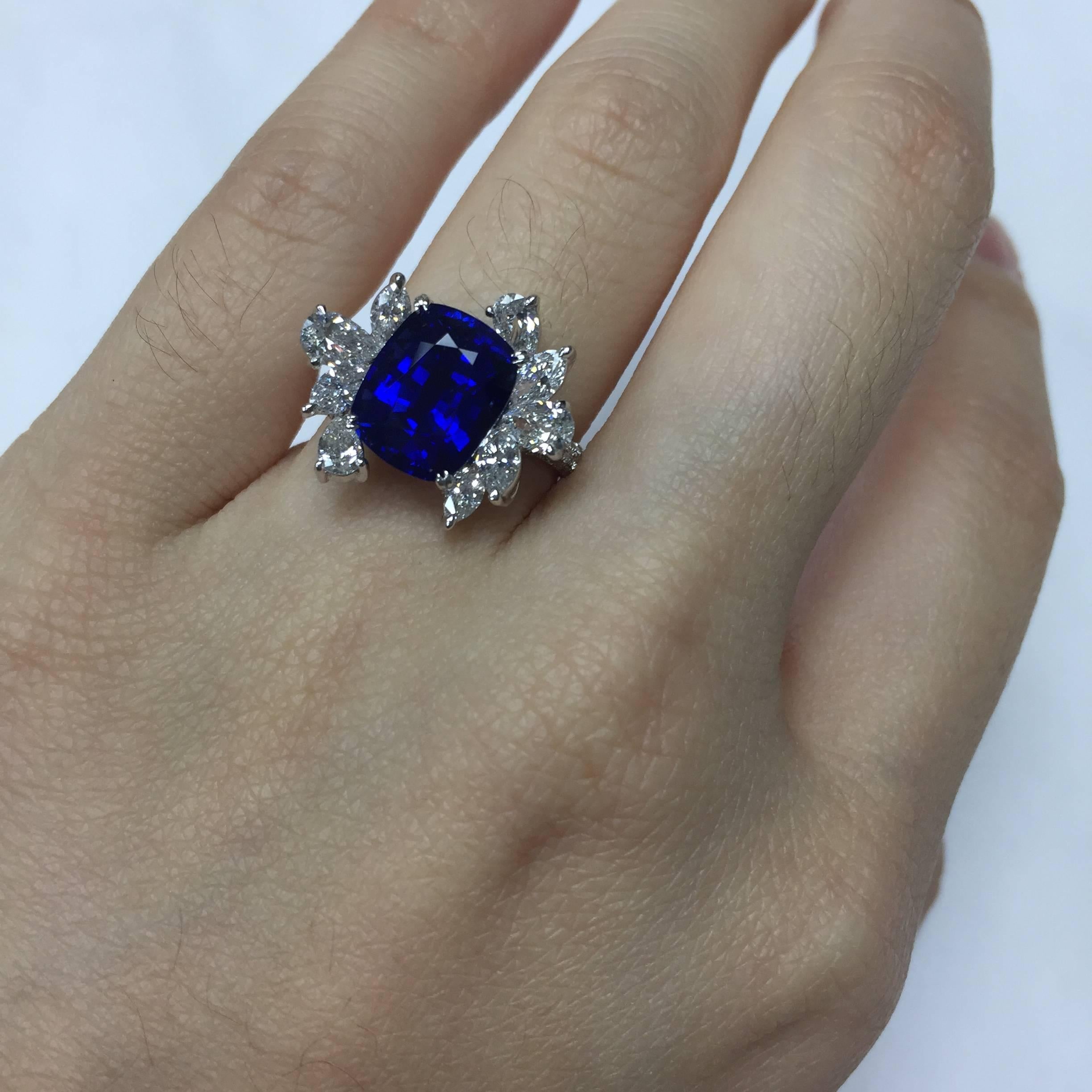 Ring in 18kt white gold set with one cushion cut blue Ceylon Sapphire (5.08 carat), 4 pear-shaped diamonds (0.63 carats), 5 marquise-shaped diamonds (0.62 carats), and 135 brilliant-cut diamonds (0.54 carats)

Total Carat Weight: 6.87ct
Total