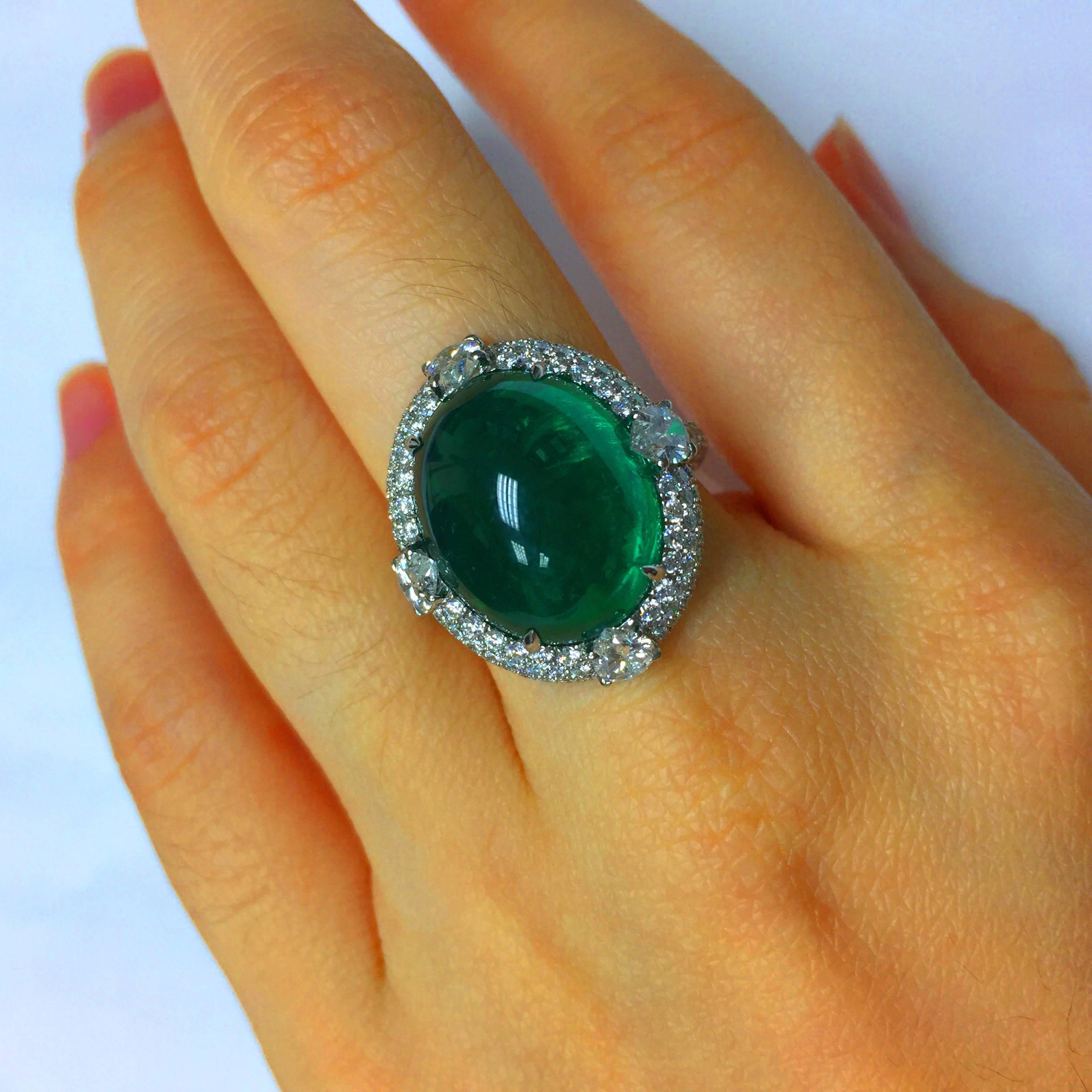 Wow! We handmade this one-of-a-kind cabochon diamond ring with micro pave diamonds and pear shapes. 

Ring in 18kt white gold set with one oval cabochon emerald (15.24 carat) Vivid Intense Green AAA quality. 

E color VVS1: four pear-shaped