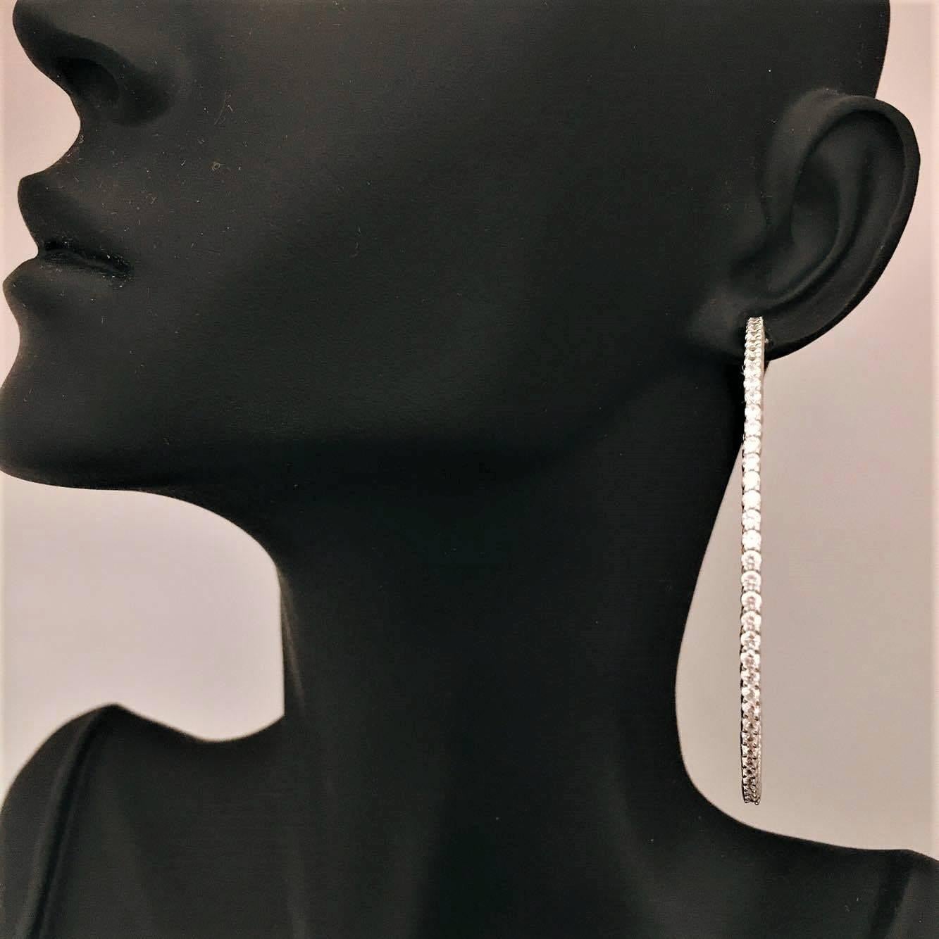 Our one of a kind push locking mechanism ensures this hoop never falls off your ear! The measurement of these hoops is approximately 2.00 inch outside to outside diameter. The total diamond weight is 3.00 Carats. The diamonds are F color Vs2