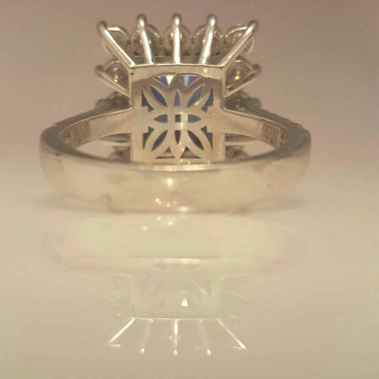 Modern Emerald Cut Diamond and Rich Blue Sapphire Ring