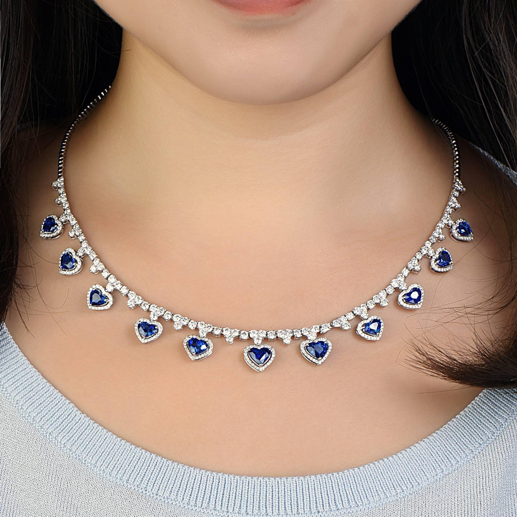 A necklace that would truly suit any royal family, it was a challenge putting together all the gorgeous heart shaped gem quality royal blue sapphires to create this unique dynamite necklace! 
Approx total weight: 18.96 cts
Diamond Color: E-F
Diamond