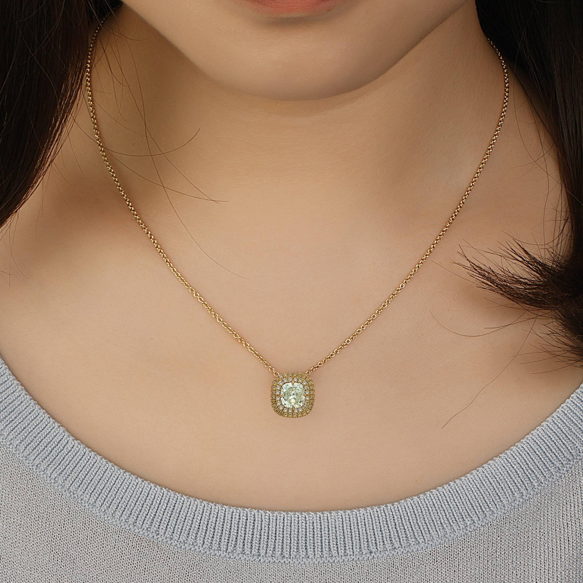 1.40 Carat GIA Certified center diamond Fancy Greenish Yellow Cushion center, what a rare stone! .28ct of vivid yellow diamonds make the rest of this gorgeous necklace into a masterpiece. Please request the certificate if interested. Set in 18K