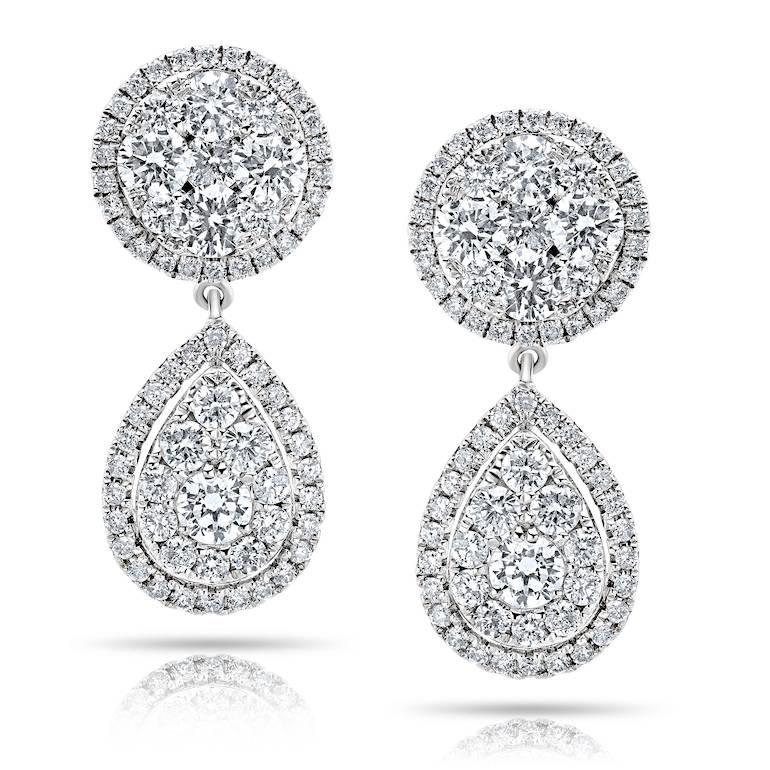 Approx total weight: 3.55CT
Diamond Color: colorless
Diamond Clarity: Vs-si
metal: 14k:  These earrings are hand made in the Emilio Jewelry Atelier in New York. We created a special illusion clustering the diamonds together to create a large single