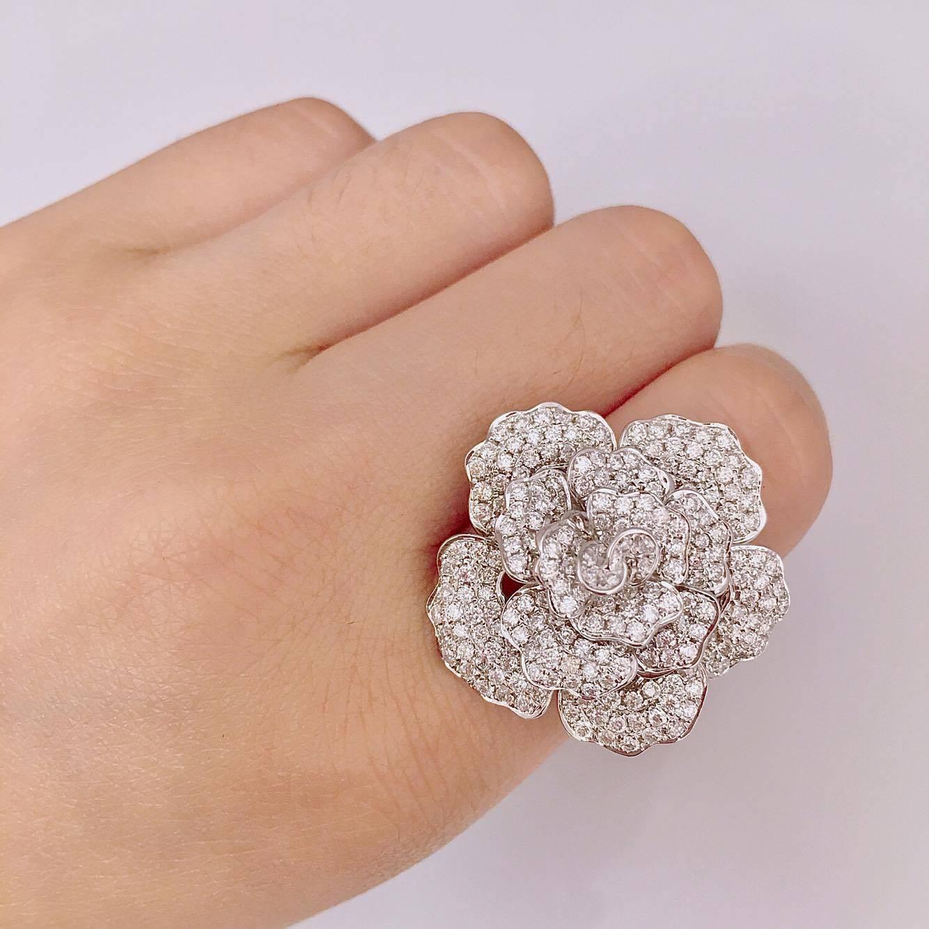 This Ring was designed and manufactured by Emilio! 243 diamonds are carefully hand set with a microscope by our skilled craftsman. 
Approx weight: 2.40cts
243 diamonds micro pave set by hand! 
Color: E
Clarity: VVS1
Cut: Excellent 
professional