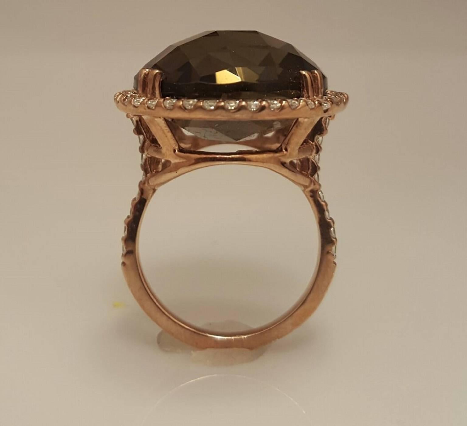 Set in 18k yellow gold, with an approx. 18mm center quartz weighing approximately 23.00ct, and approximately 1.00ct t.w. Diamonds. Ring Available in different color quartz as well as all gold colors. 
All Sizes Available. 