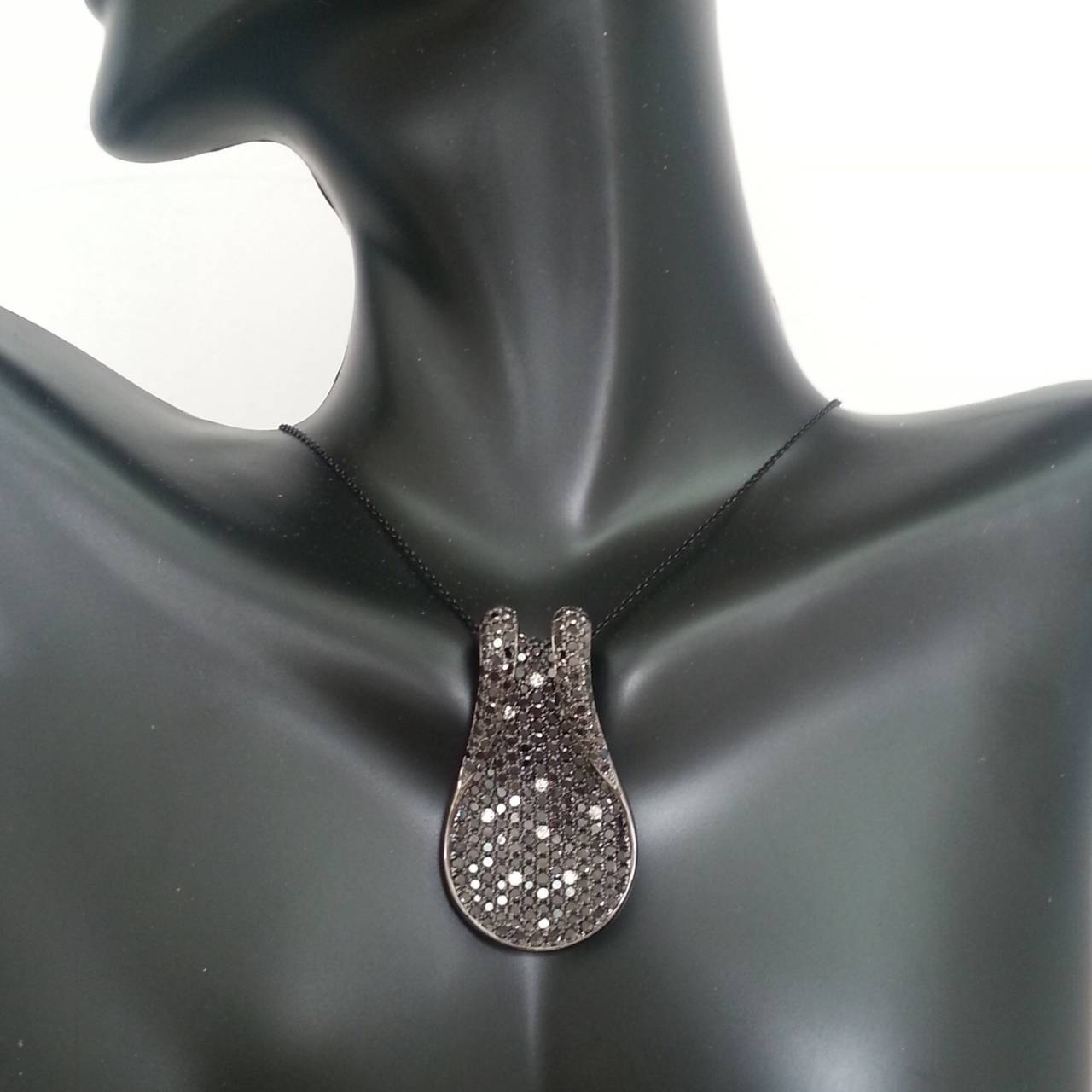 251 Excellent cut AAA quality natural black diamonds, micro pave set one by one by our very own skilled craftsmen. This pendant took over 6 months to complete! There is absolutely no gap in between the diamonds which gives this piece a rich elegant