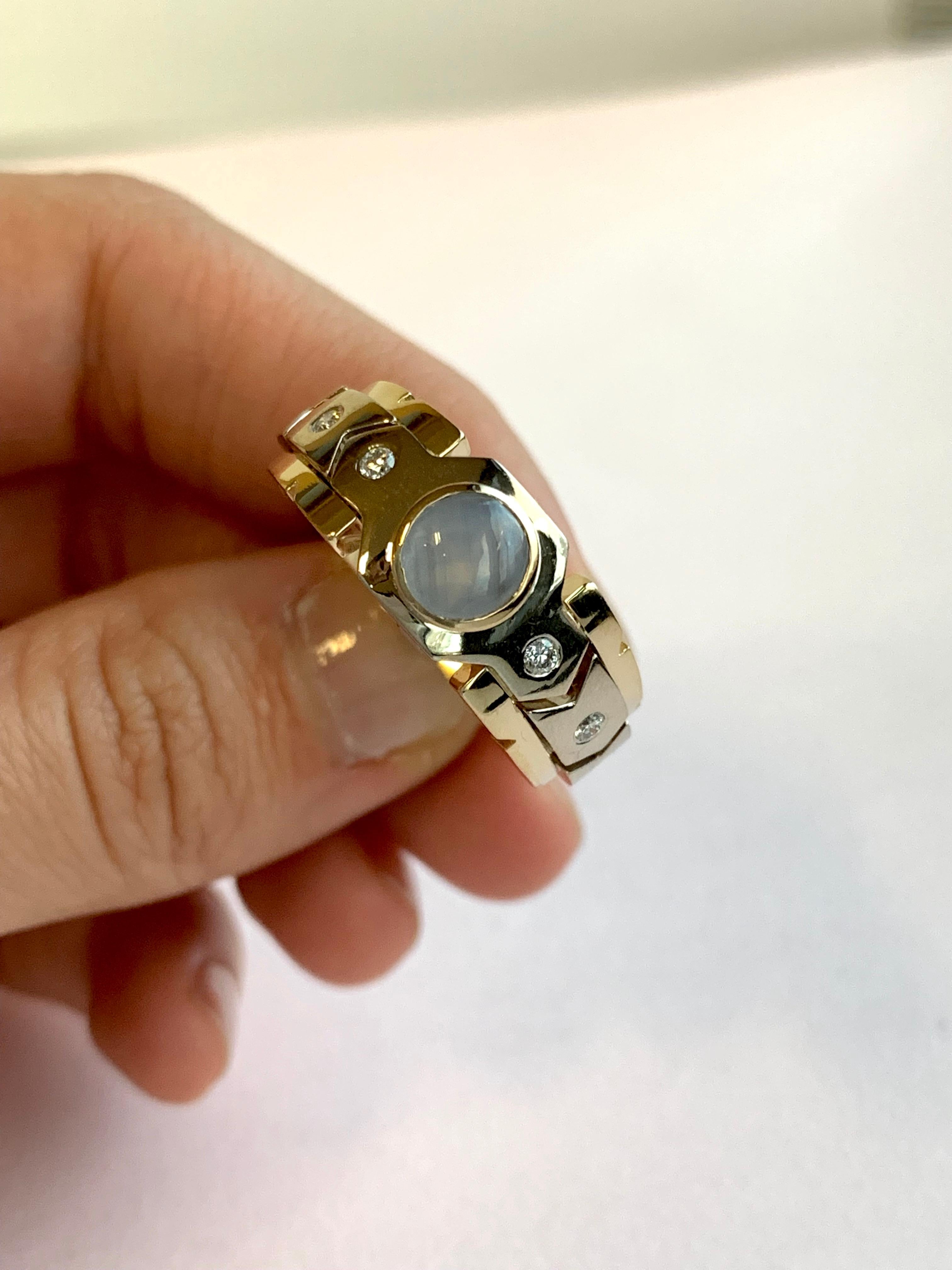 Material: 14k Two Toned Gold
Gemstones: 1 Round Star Sapphire at 1.10 Carats Measuring 6 mm
Diamonds: 4 Brilliant Round White Diamonds at 0.13 Carats. SI Clarity / H-I Color. 
Ring Size: 9.5. Alberto offers complimentary sizing on all rings.

Fine