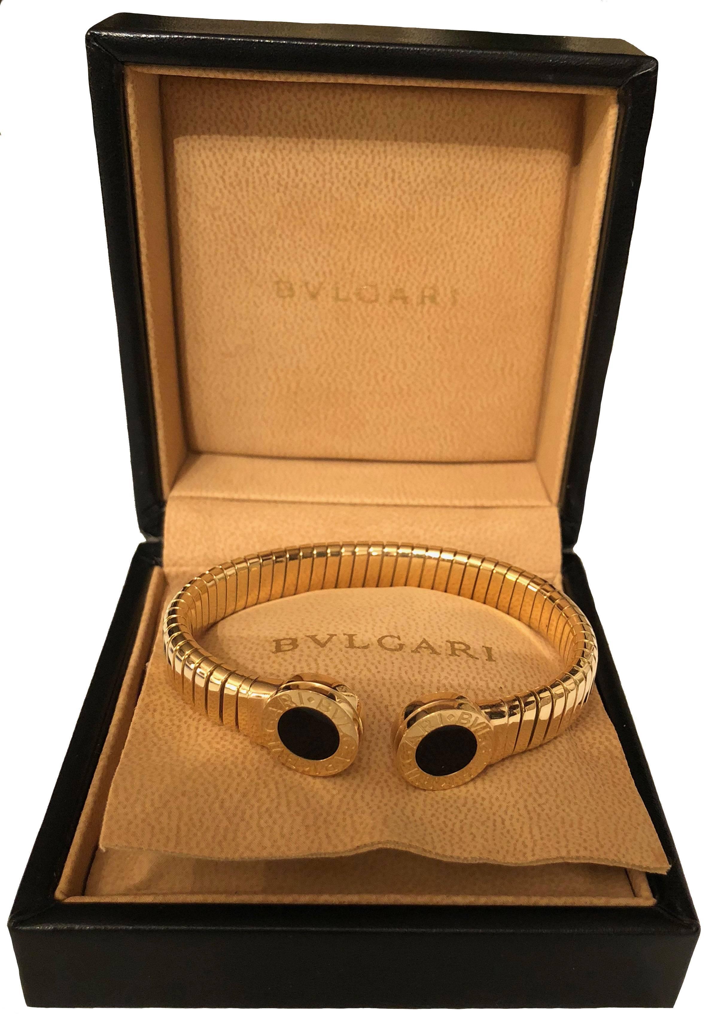 Elegant and sophisticated bracelet from the Bulgari-Bulgari Collection. 
 
Material: 18k Yellow Gold and 2 onyx stones encased with a gold trim engraved with BVLGARI.
Weight: Average 34 gr. 
Condition: Like new
Comes with: Bulgari original box 

All
