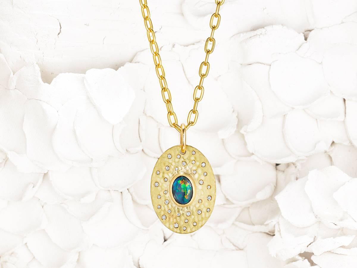 Coat of Arms Pendant - Diamond Array
A 1.7 ct solid Hopkins Australian opal and the brightest Canadian diamonds (VS F/G quality) dance with light in this 8+ grams, 18 and 22 karat reclaimed gold pendant. 

Made to last for generations.

Thesis Gems