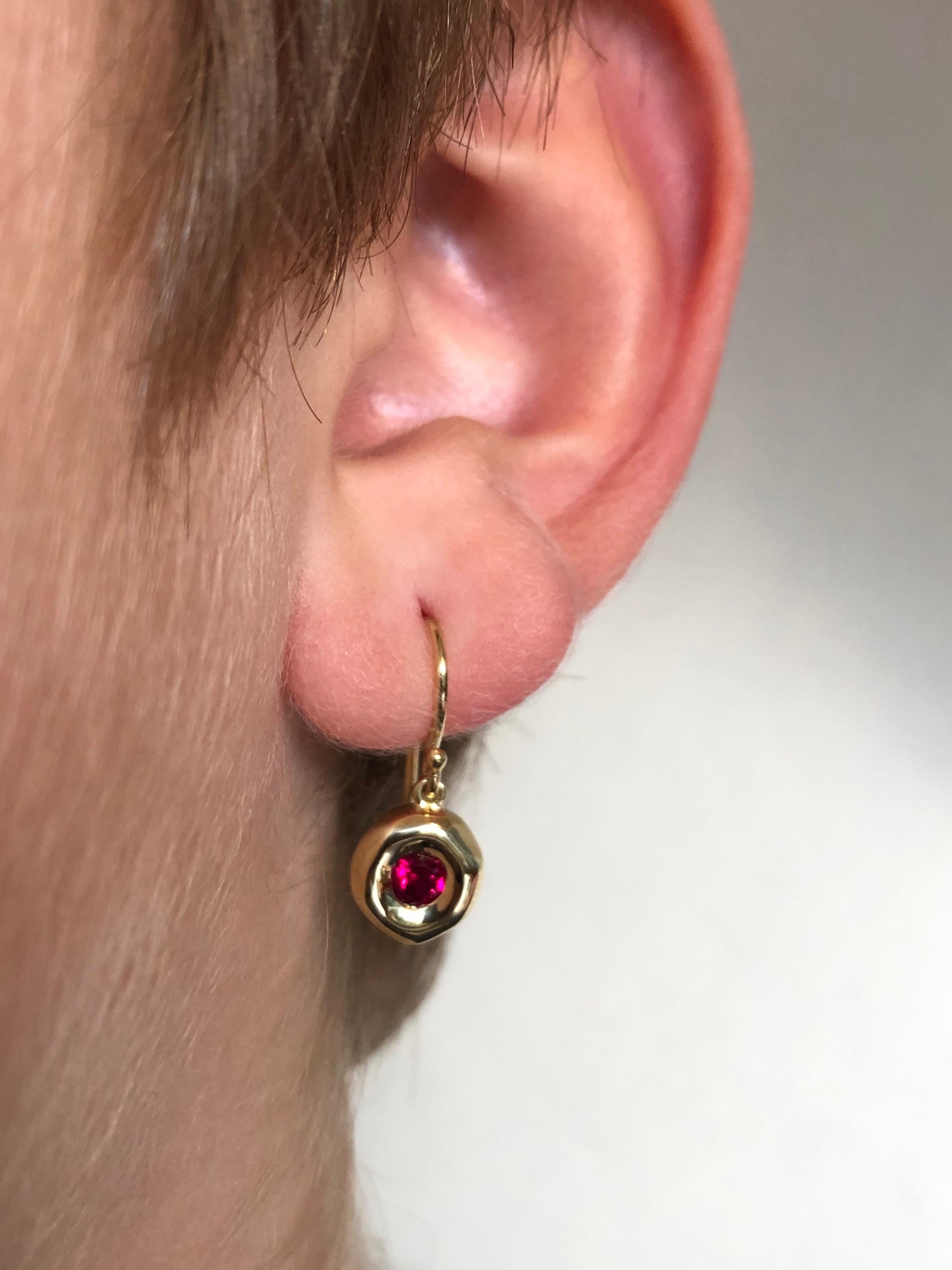 
Gemfields Mozambique rubies set in 18 karat solid gold bezel, on a french hook. $3,900.

Dimensions: 1.7 cm from top of french hook arch to bottom x 0.8 cm in width x 0.3 cm depth. 4 grams.

5 mm Gemfields Mozambique rubies

These earring were hand