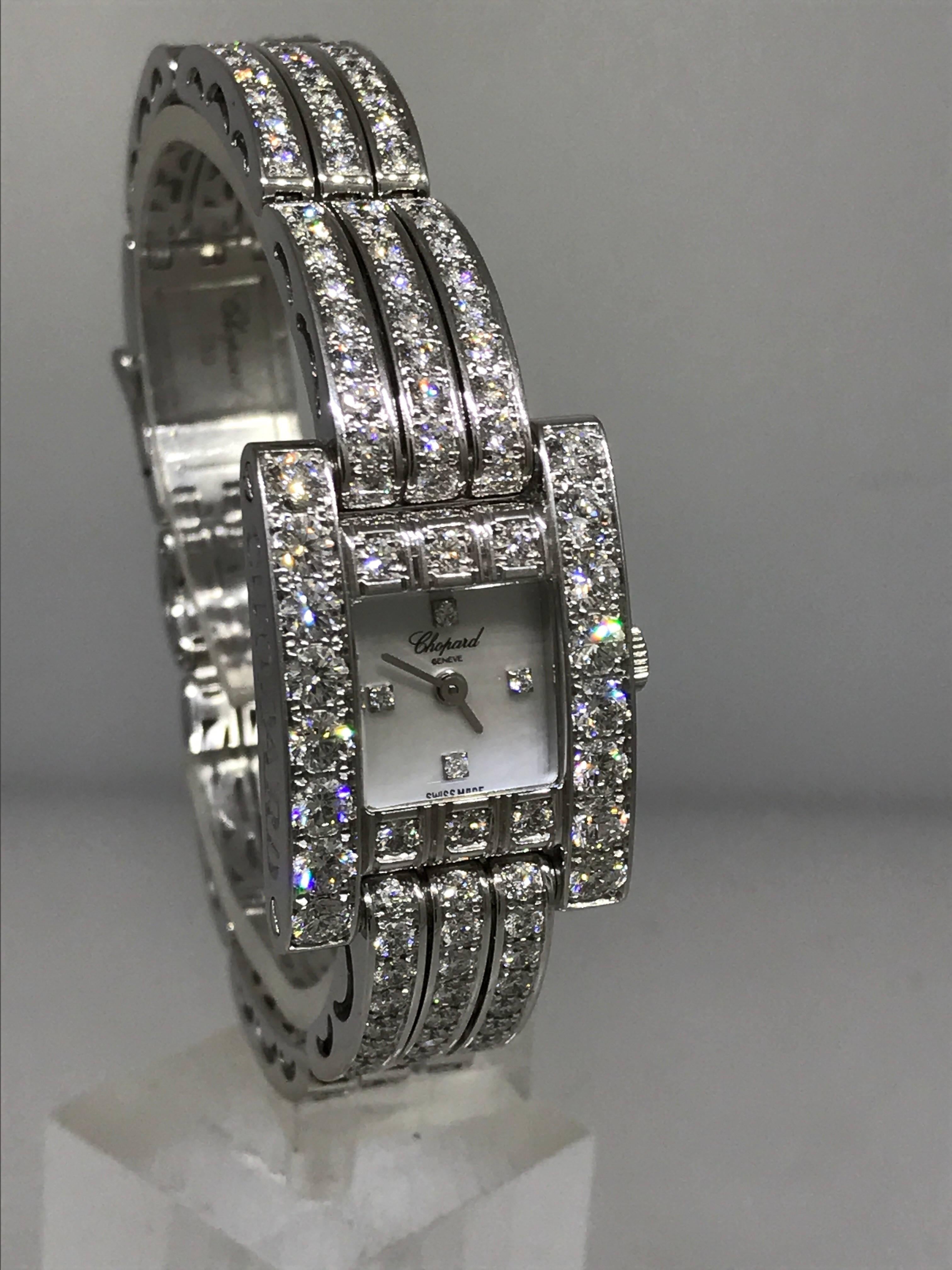 Chopard ladies H watch 

Model number: 10/6966-1001

100% Authentic

Brand New (Old Stock

Comes with original Chopard box, certificate of authenticity and warranty, and instruction manual

18 Karat white gold case and bracelet

216 diamonds on the