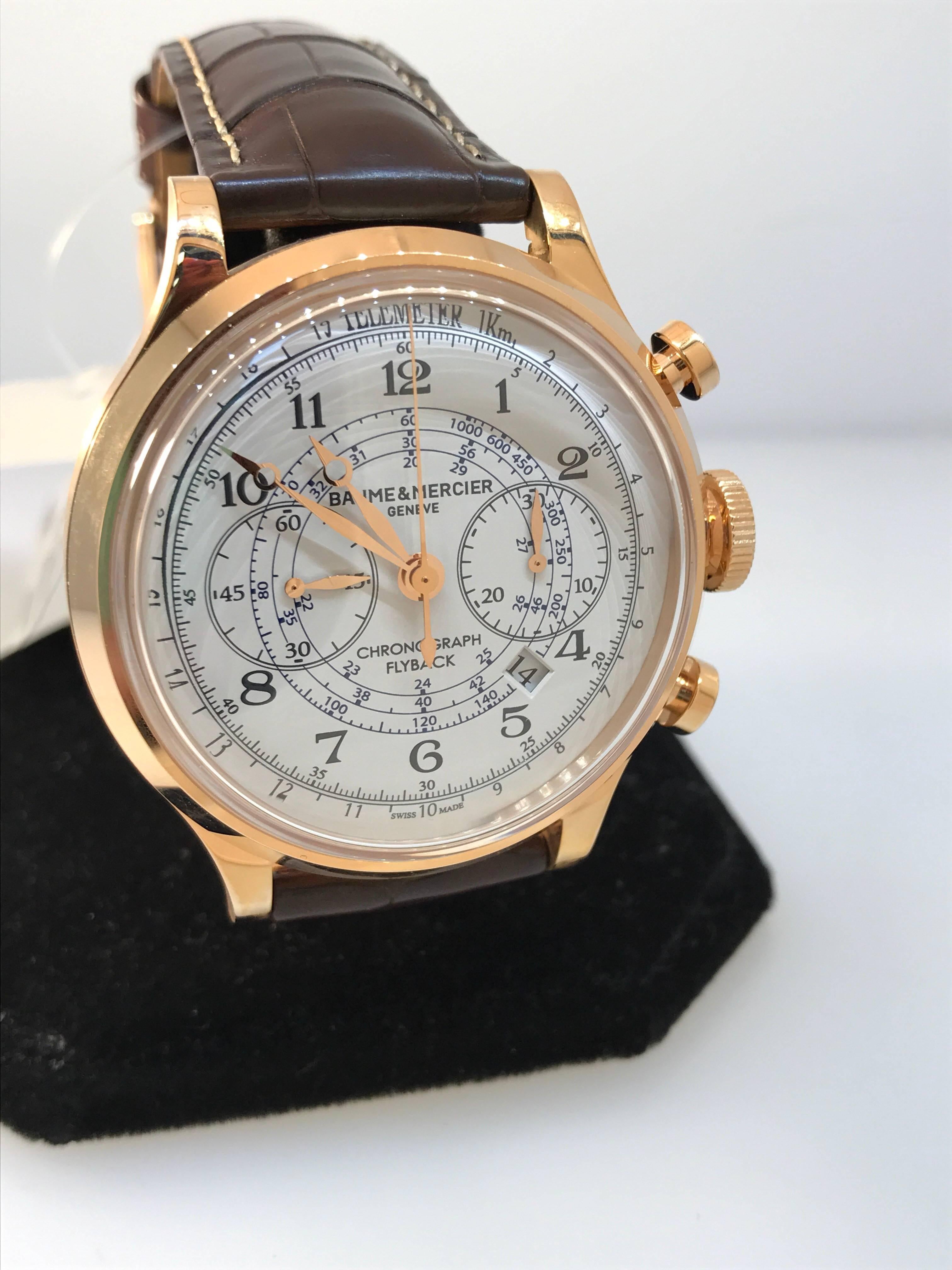 Baume and Mercier Capeland Men's watch

Model number M0A10007

Brand New

Comes complete with original Baume and Mercier box, warranty card, and instruction manual

18 karat rose gold case and buckle

White dial and subdials

Arabic numeral hour