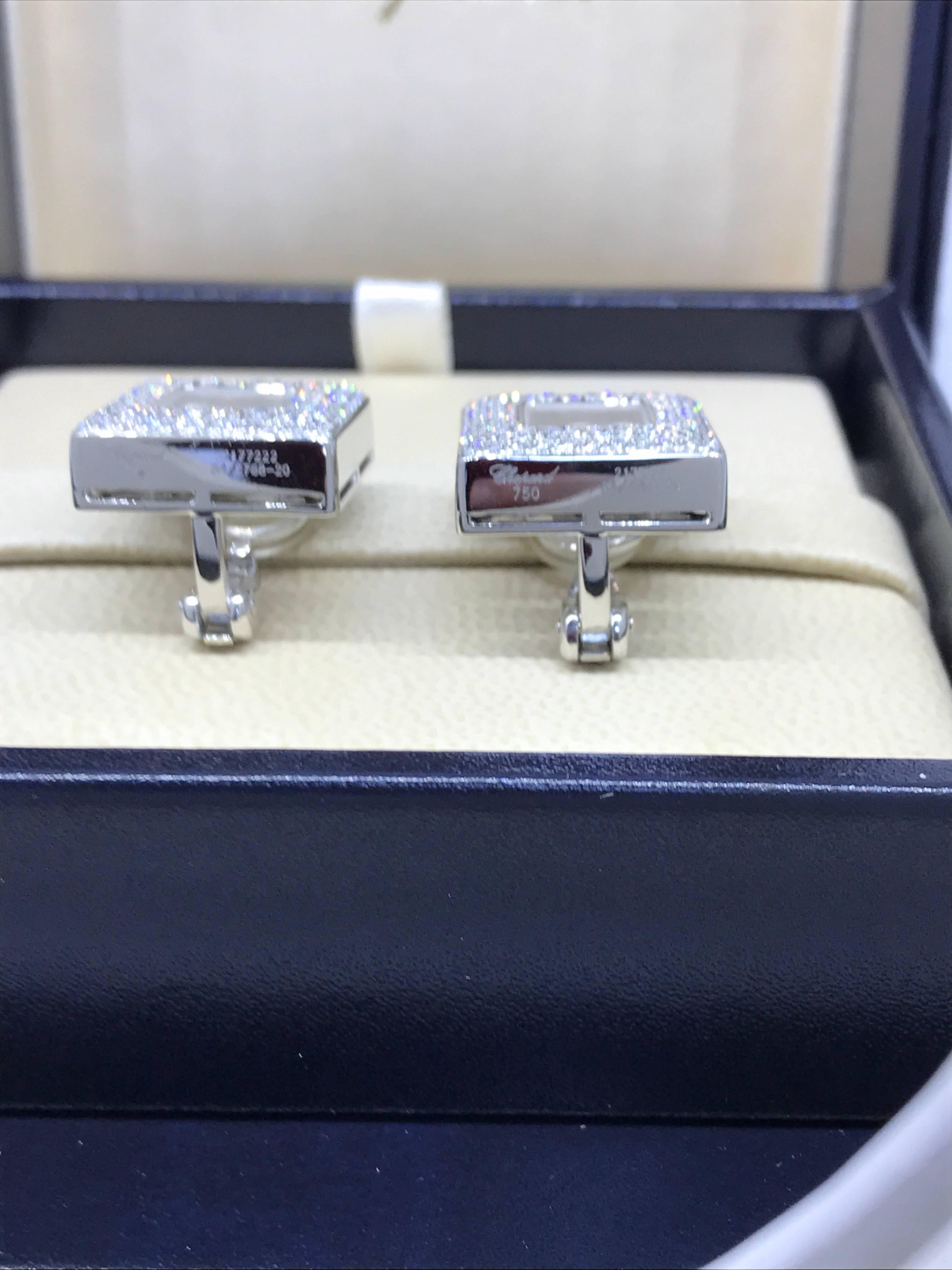Chopard Happy Diamonds Square Earrings

Model number 84/2768-20

100% Authentic

New / Old Stock

Comes with original Chopard box, certificate of authenticity and warranty and jewels manual

18 Karat White Gold

Clip-On Style

200 Diamonds on the