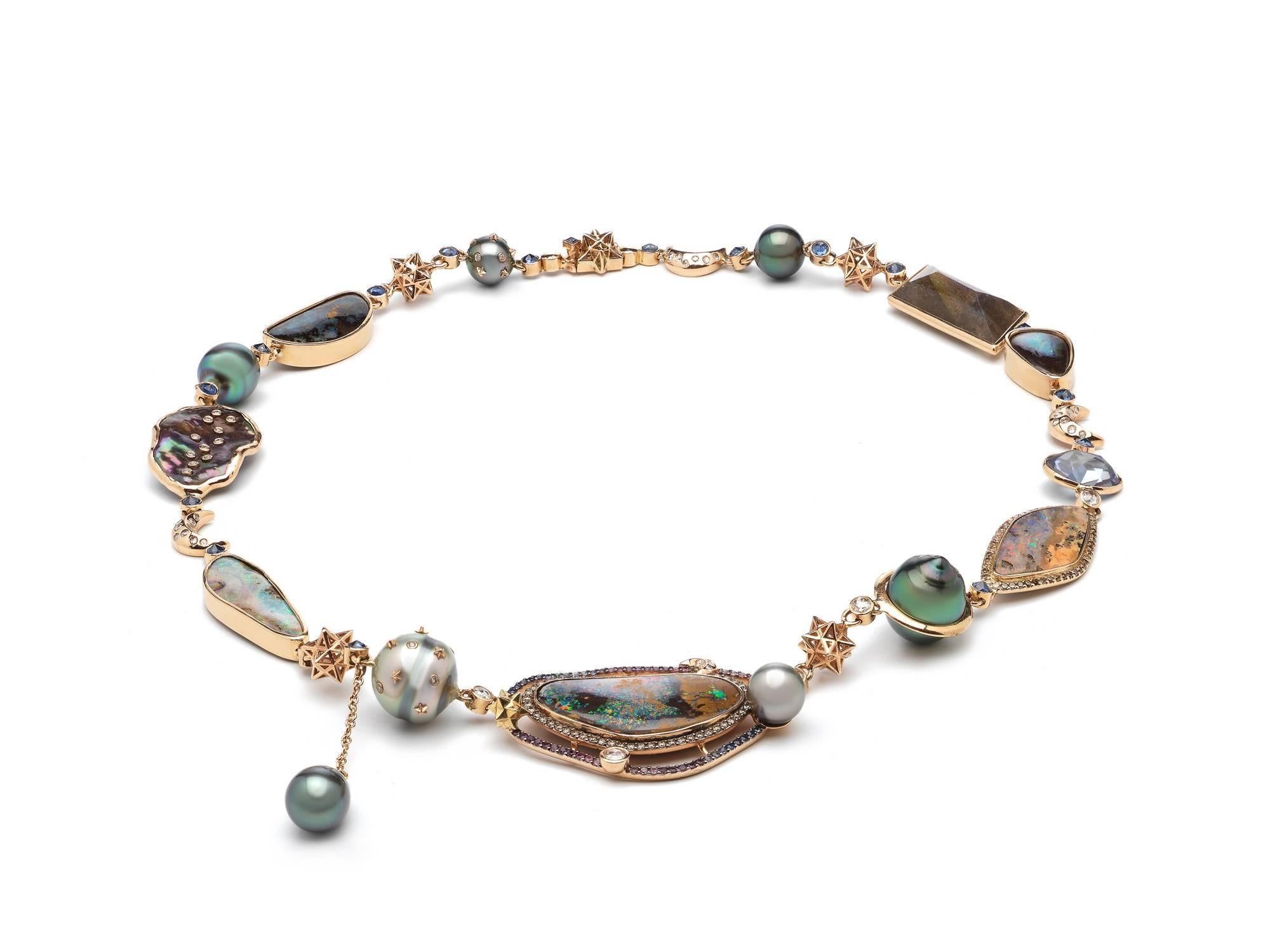 The Galaxy Necklace is made of 18ct rosé gold, white diamonds, opals, blue sapphires, tourmaline and tahitian pearls. A very unique and one of a kind piece. The lock is hidden in a 3D star, and all opals are set in 18 carat golden settings. 