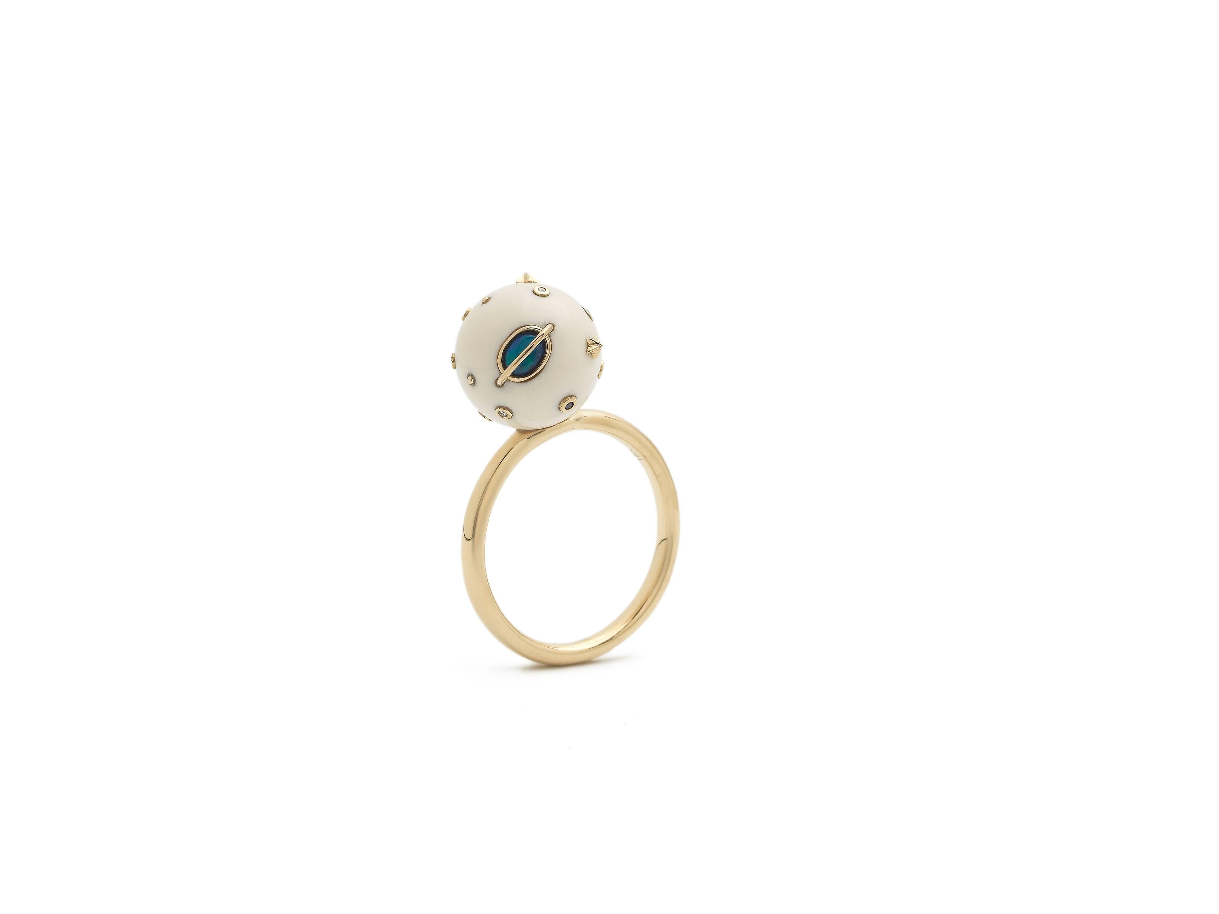 The Small Mammoth Galaxy Ring, by Bibi van der Velden, combines 18k Yellow Gold with 40,000 year old Mammoth Tusk, Opals, Diamonds and Blue Sapphires. This ring is from the Galaxy Collection, inspired by the mysterious and intriguing cosmos we live