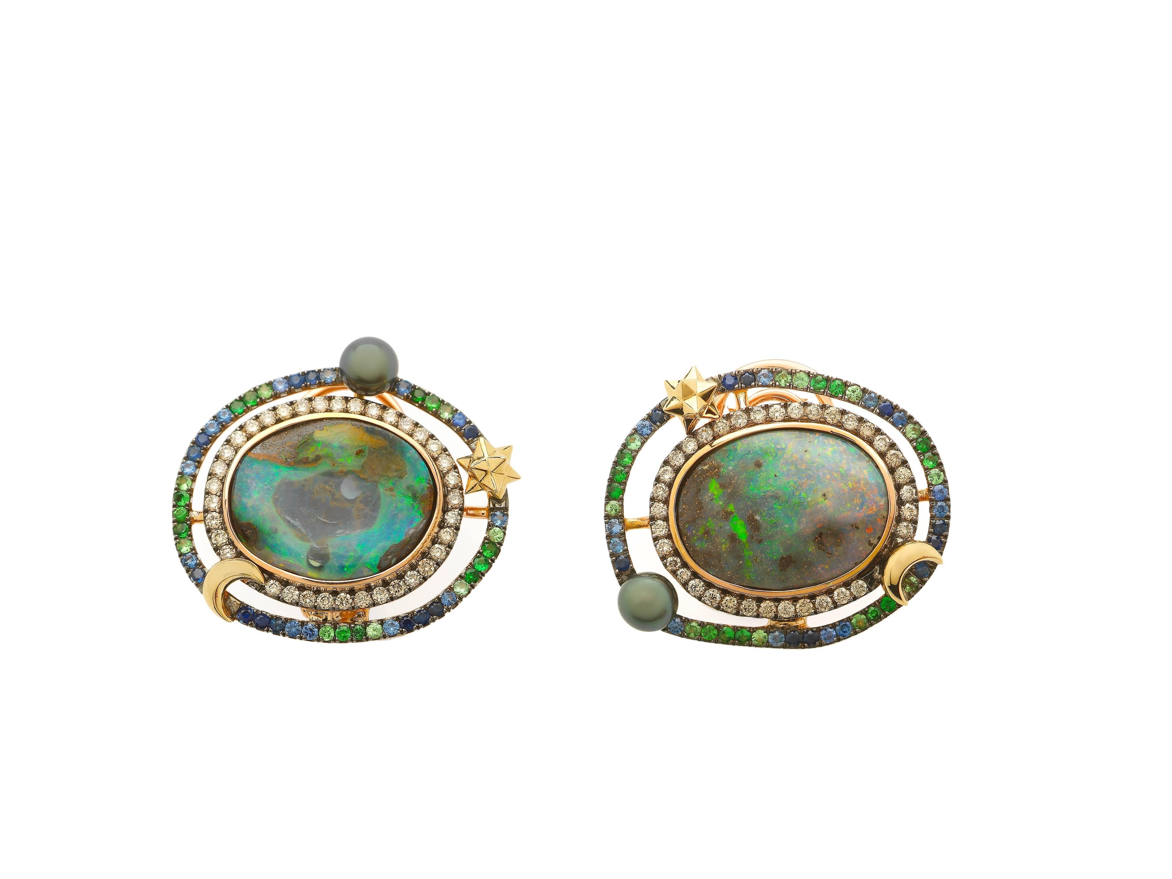 The Opal Orb Earrings, by Bibi van der Velden, are made of 18k Rose and Yellow Gold and include beautiful Boulder Opals, surrounded by orbs of Brown and White Diamonds, Blue Sapphires, Tsavorites and Keshi pearls. The earrings include secure Omega
