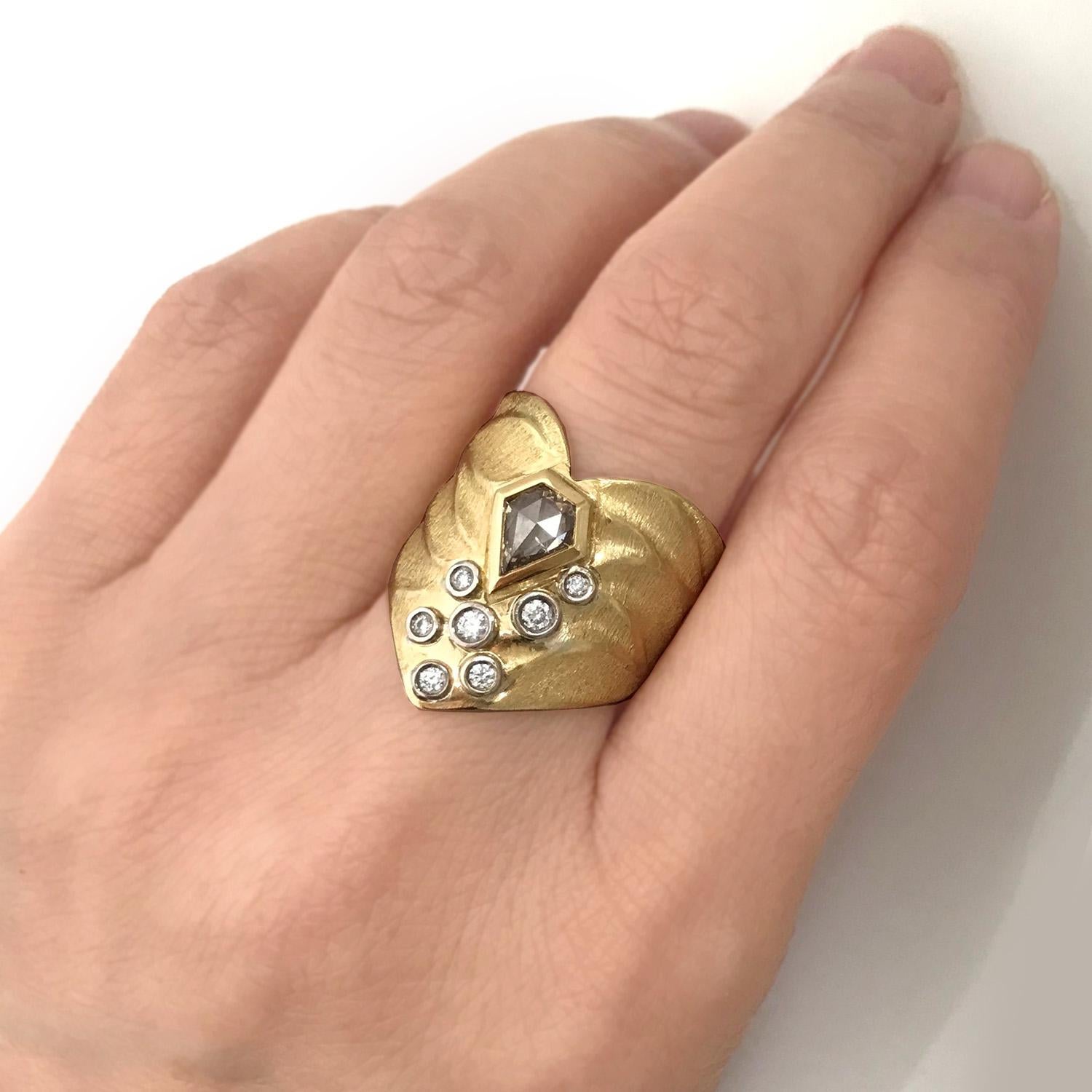 K.Mita's Chevron Heart Ring, which is made from 18 Karat Yellow Gold, features a 0.44 Carat Kite Shape Champagne Diamond accented with 0.165 Carat White Diamonds (total weight) set in 18 Karat Palladium White Gold. Ring Size 6.25 (contact us to