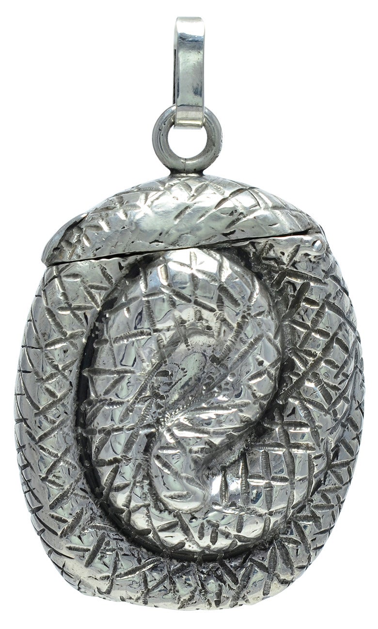 A great figural sterling silver match safe.  A double-sided representation of a snake.  Well detailed, in high relief, with bright green glass eyes.  Made in the USA, circa 1890.  2