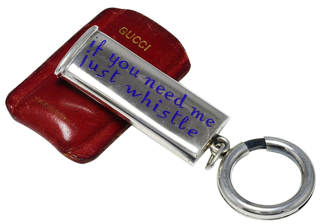 One of a kind sterling silver whistle with blue enamel lettering; 
