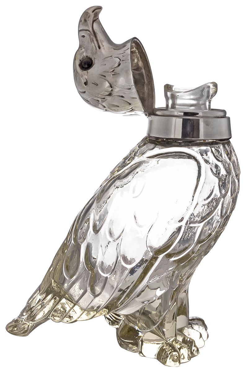 Fabulous antique figural eagle decanter. Made in Austria, circa 1900. Carved textured glass body. Silver-plated collar and head. Glass eyes. 9