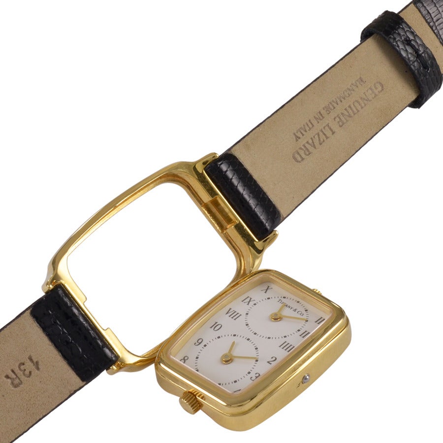 Ladies gold dual zone watch. Made and signed by TIFFANY & CO. Double border 18K yellow gold. Original Tiffany & Co. buckle. Lizard band. Precision quartz movement. A most interesting and practical watch.

Alice Kwartler has sold the finest antique