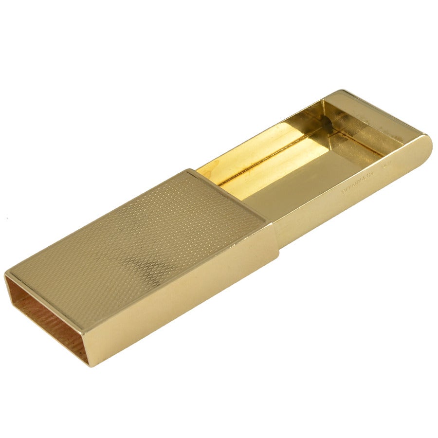 Estate  gold pill box made and signed by Tiffany & Co.
Excellent secure slide mechanism. Textured 14k yellow gold. 1 3/4