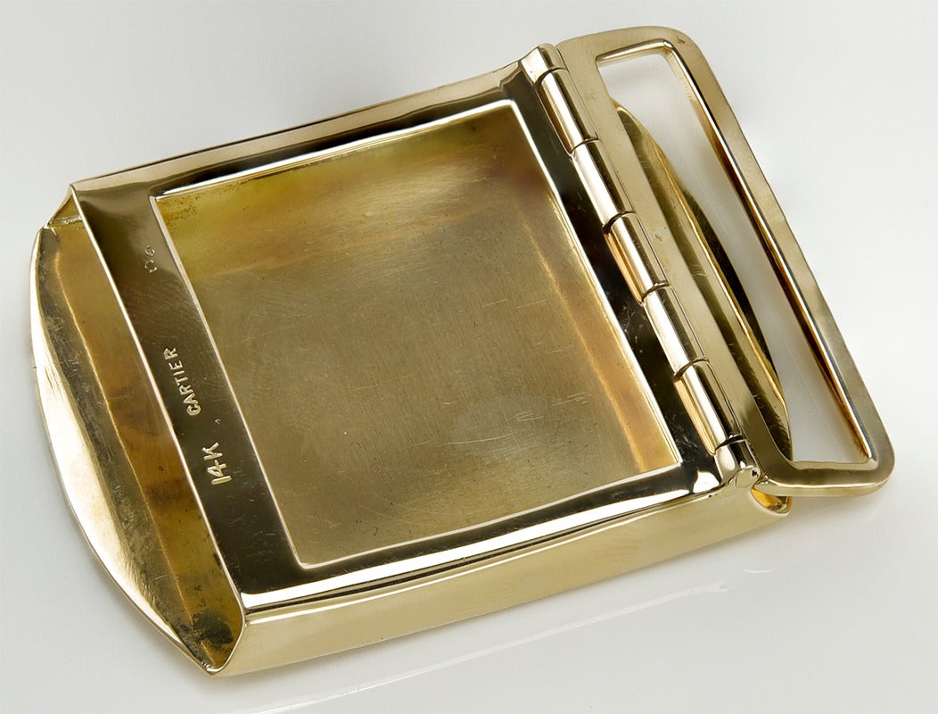 Handsome rose gold belt buckle.  Made and signed by Cartier.  14K. 
2