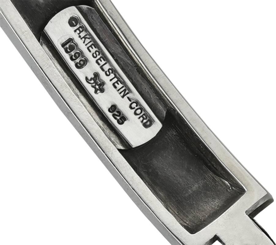 Handsome dog collar.  Made and signed by BARRY KIESELSTEIN-CORD.   Heavy  sterling silver links, with two interspersed leather links and an adjustable chain collar.  Has a folding link in the center, made to suspend a dog tag.  Never engraved.  